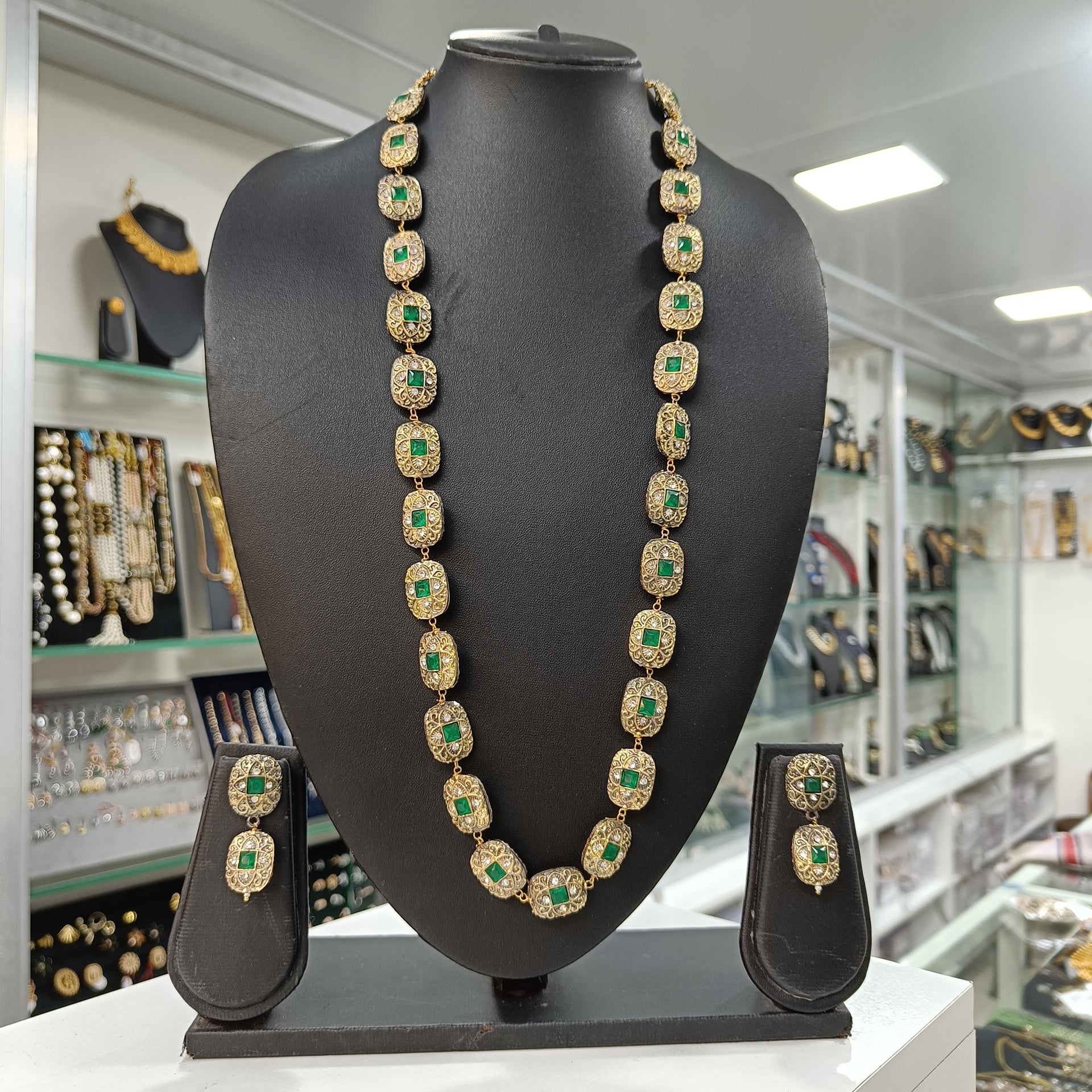 Haritika Brass Fusion Long Jewellery Set with Green Beads | JewelOn