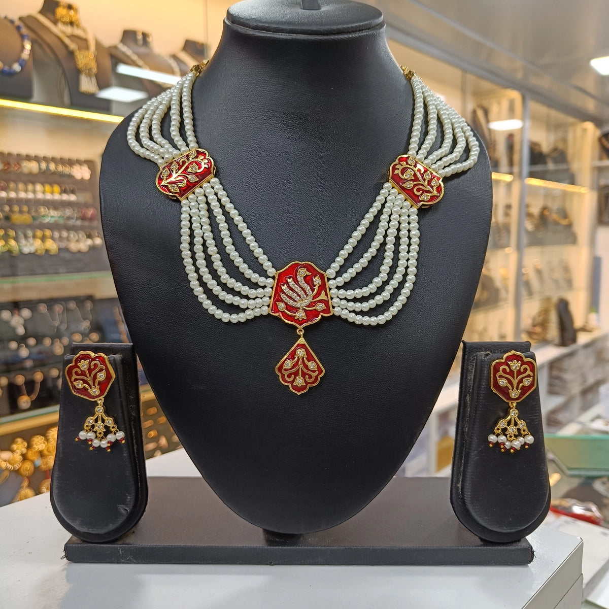 Navya Meena American Diamond White Moti Red Necklace Set