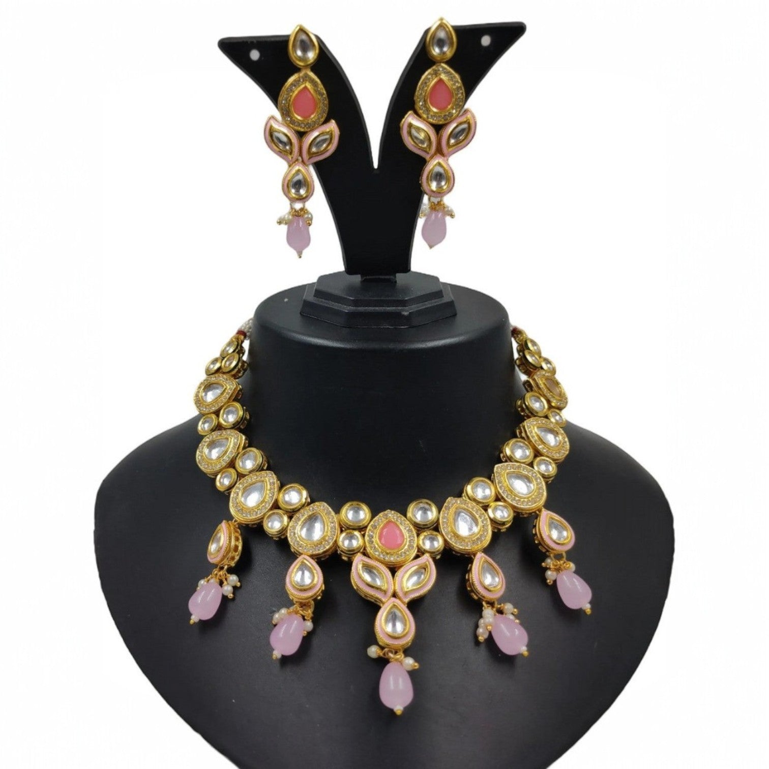 JewelOn baby pink Kundan choker necklace and earrings set with gold-tone metal, clear stones, and pink beads.