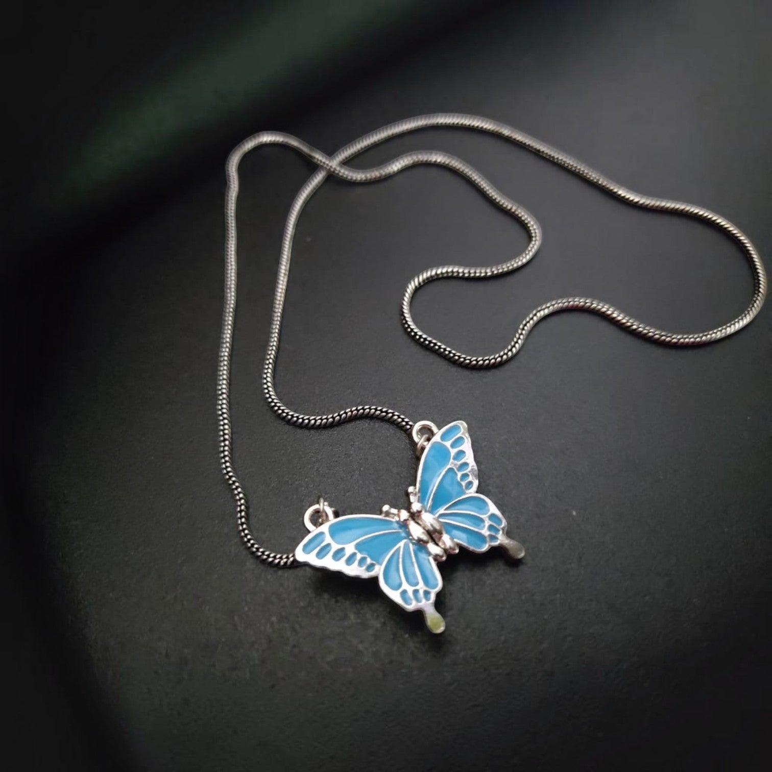 JewelOn Modern Highlight Magnetic Pendant Necklace Set with blue butterfly pendant and silver chain.