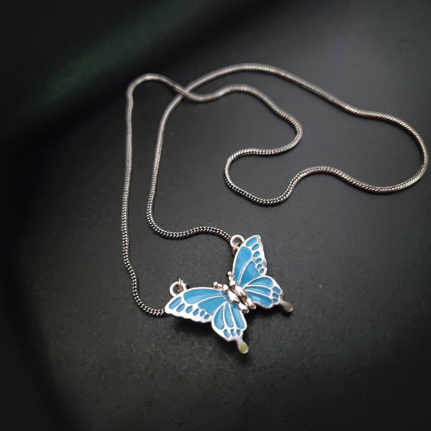 JewelOn blue enamel butterfly pendant necklace with silver chain. Oxidised western style.
