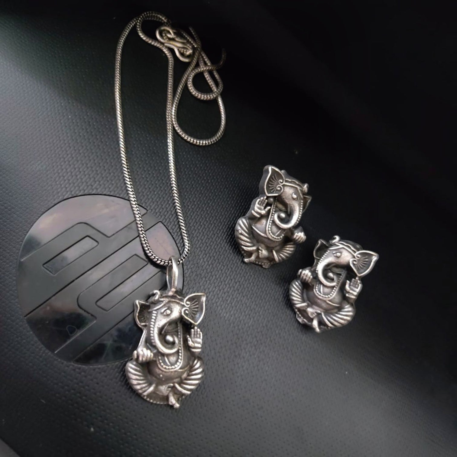 JewelOn Maya Alluring Appeal Ganeshji Oxidised Pendant Set with matching earrings. Silver tone, intricate Ganesh design.