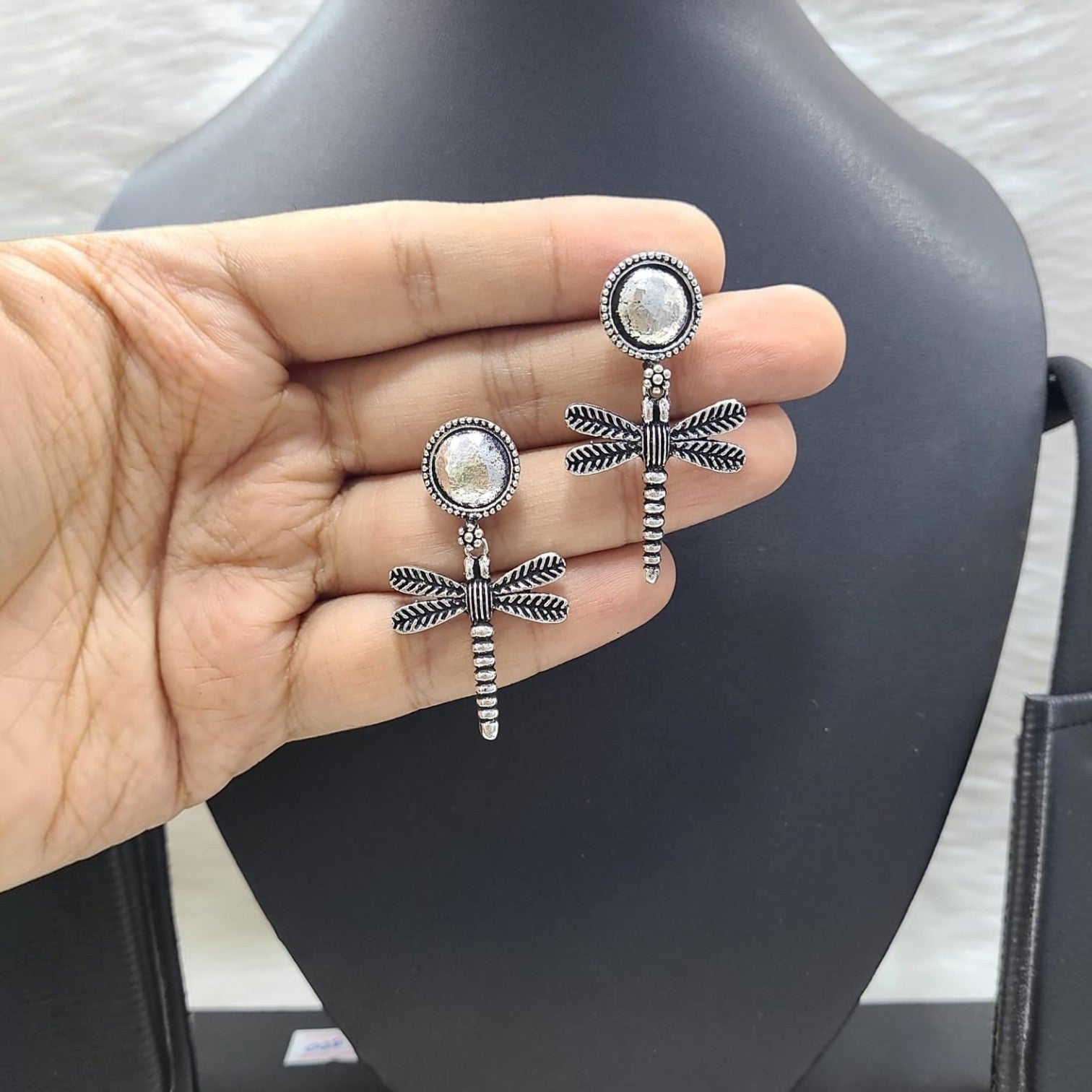 JewelOn Adorable German Silver oxidized dragonfly earrings with textured round tops.