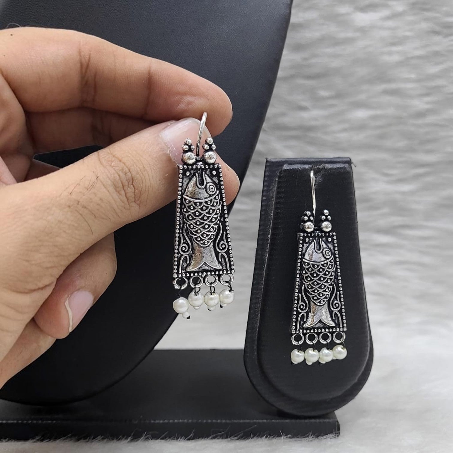JewelOn Darling German Silver oxidised fish earrings with pearl drops. Intricate detailing and traditional design.