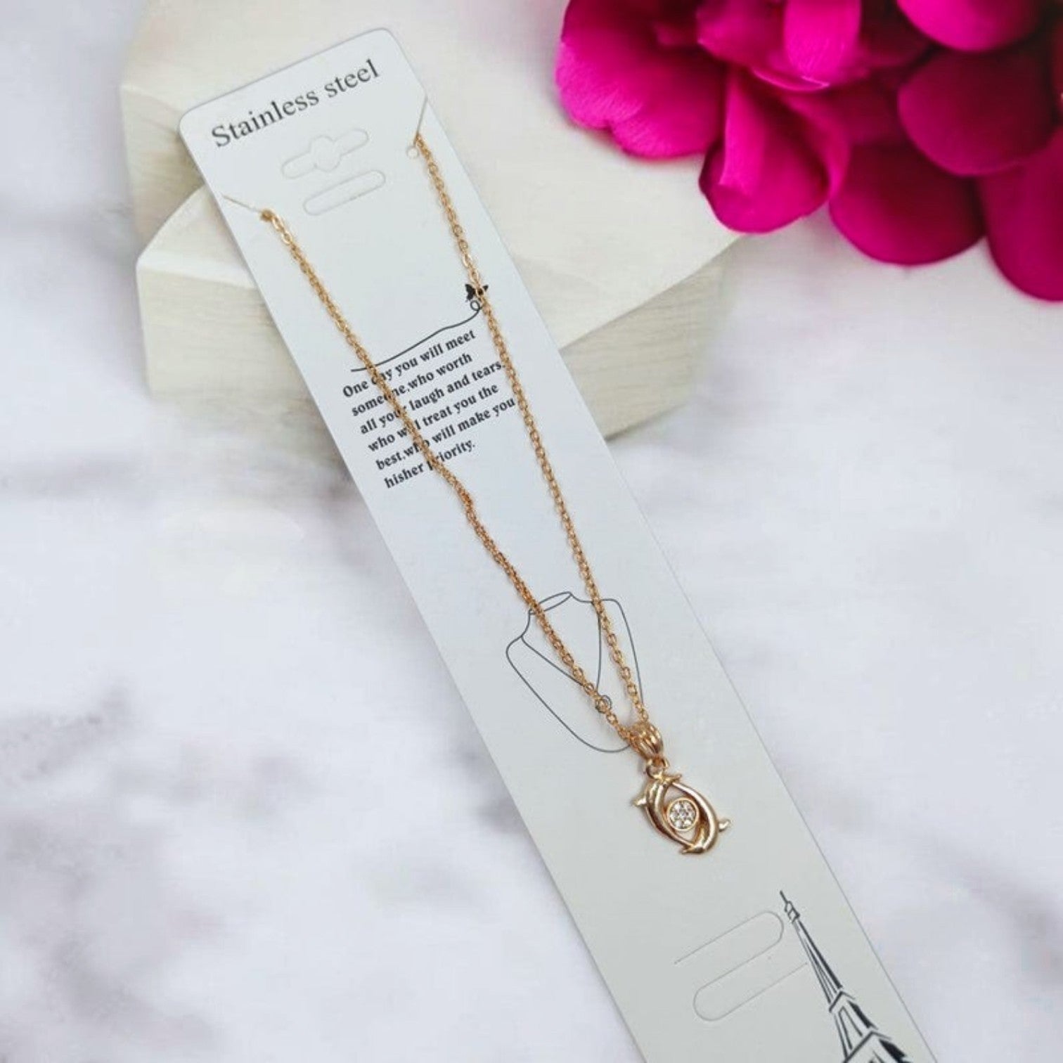 JewelOn Fashion Jewellery Store Online gold-tone pendant necklace with a dolphin-shaped charm and clear crystal accent.