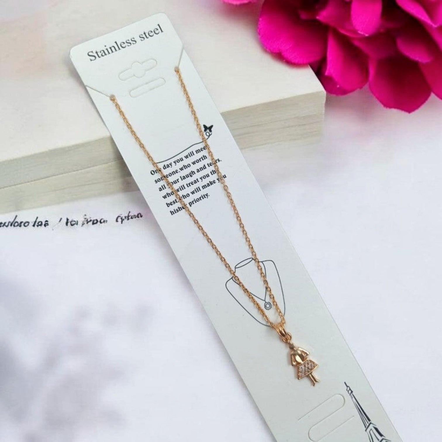 JewelOn gold-tone pendant necklace with a girl charm adorned with small crystals on a delicate chain.