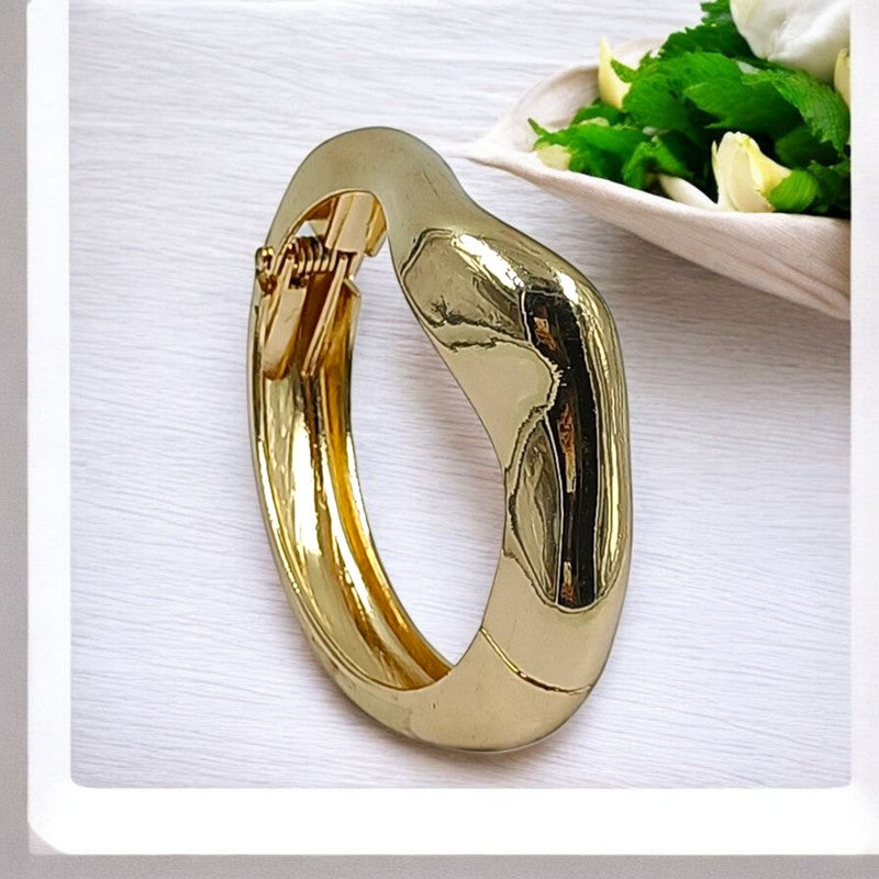 JewelOn gold-tone openable kada bracelet with a modern, broad design and a meadow collection motif.