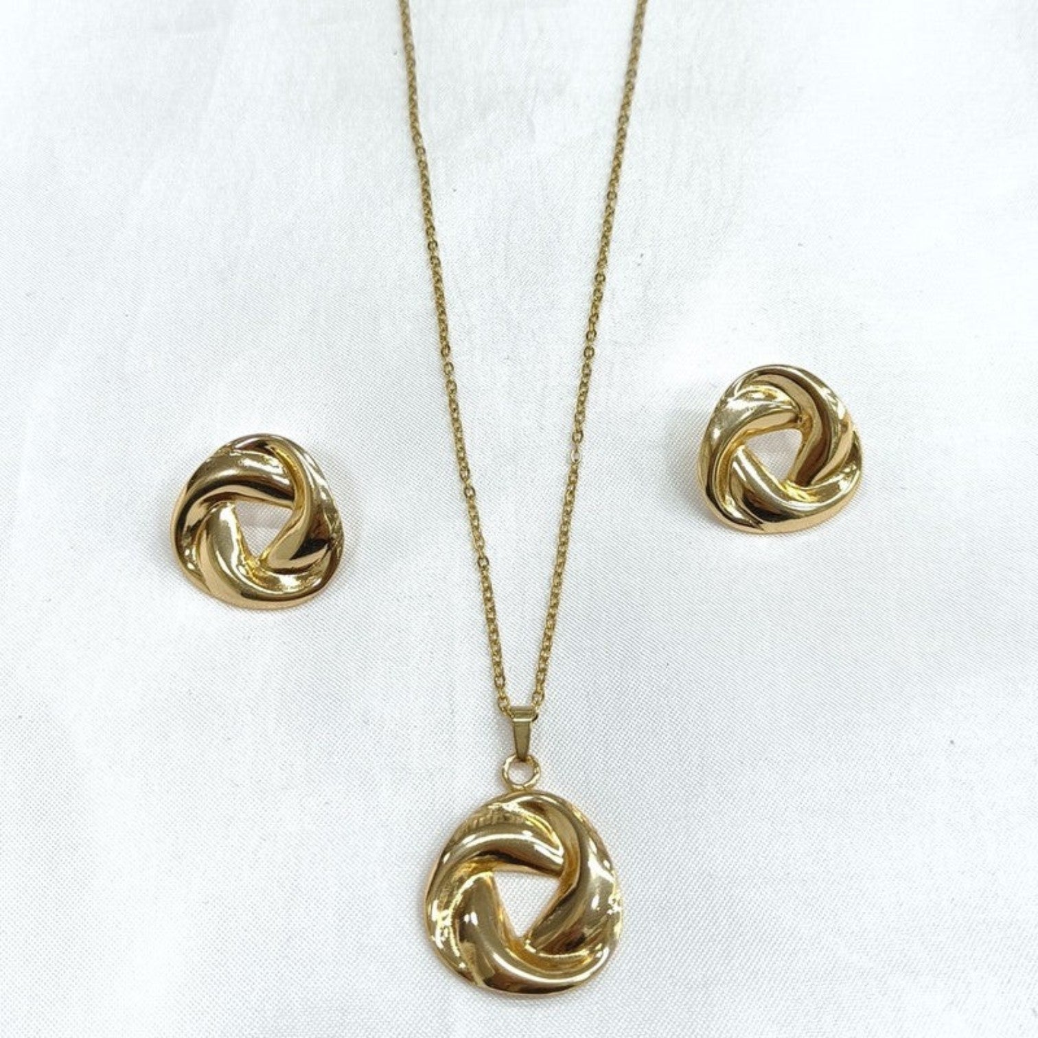 JewelOn gold-tone twisted knot pendant necklace and matching stud earrings set.