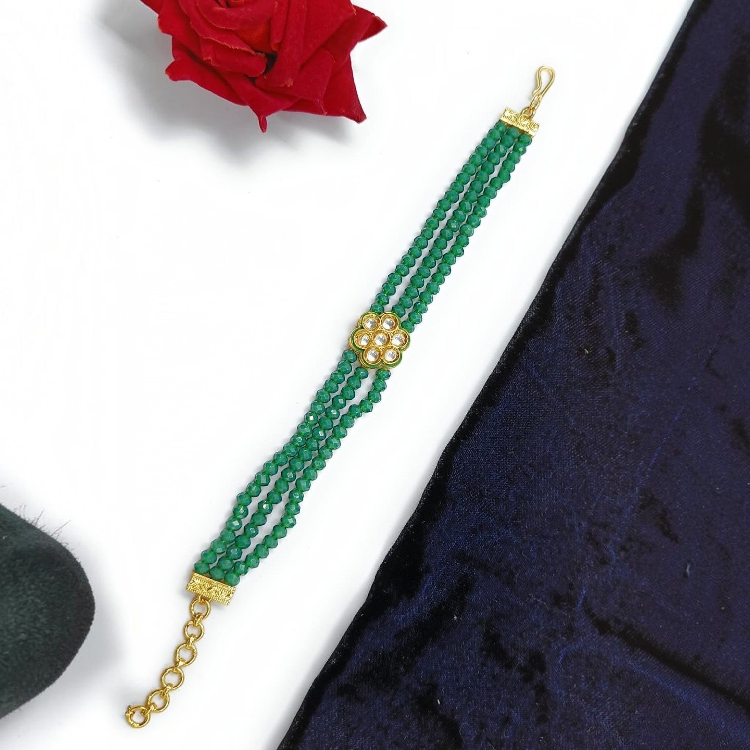 JewelOn green beaded adjustable bracelet with a floral kundan stone centerpiece for women and girls.