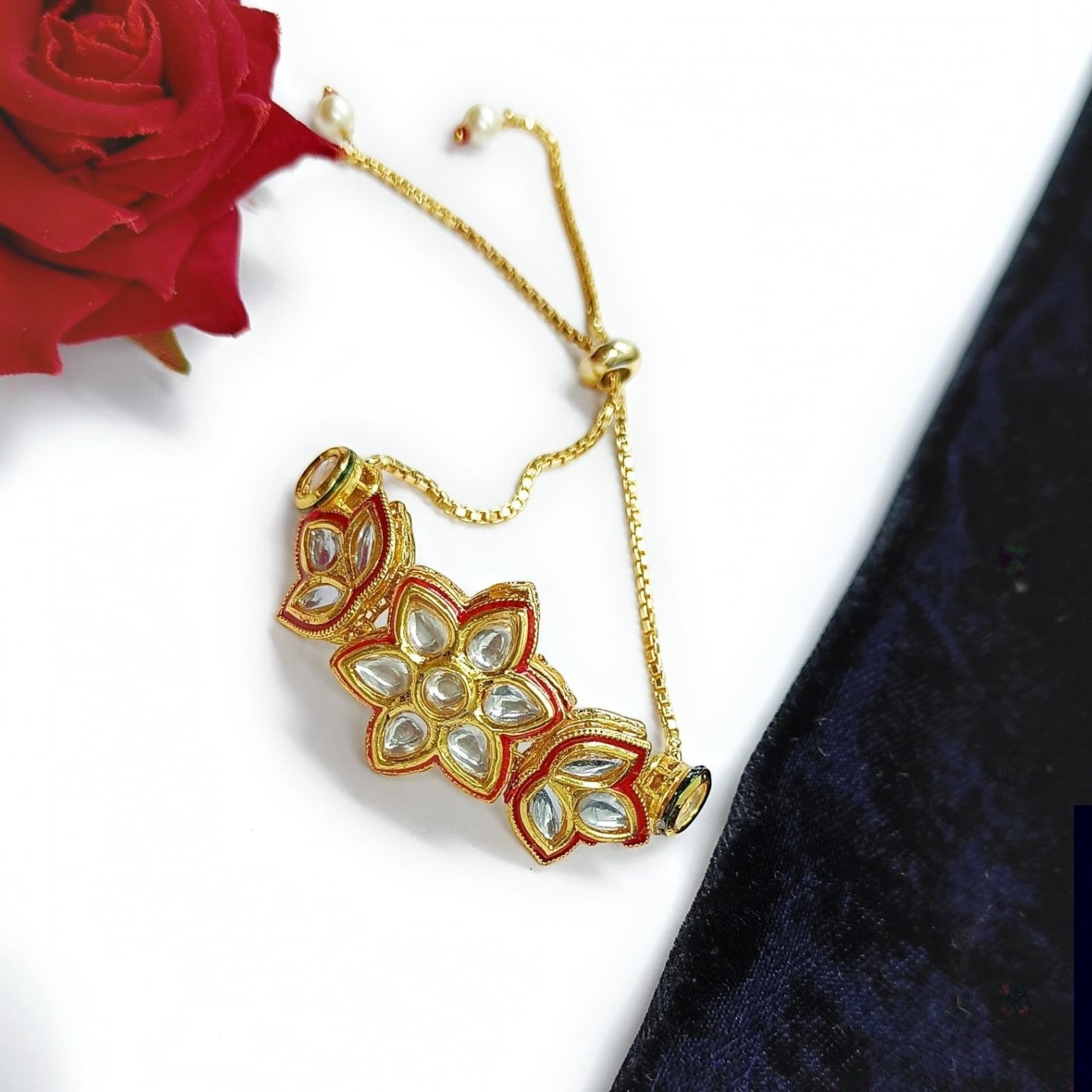 JewelOn Whimsical Inspiration Kundan Adjustable Bracelet with floral design, red enamel, and clear stones.