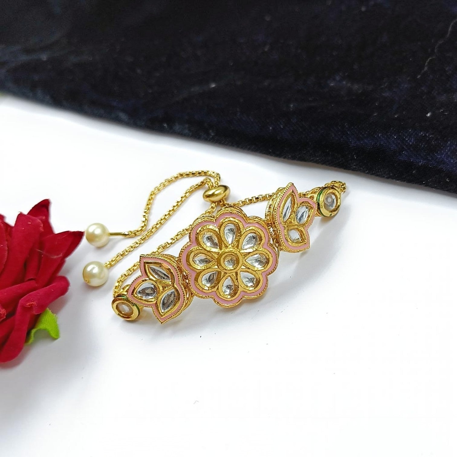 JewelOn gold-tone adjustable bracelet with pink enamel floral motifs and kundan stones, pearl accents.
