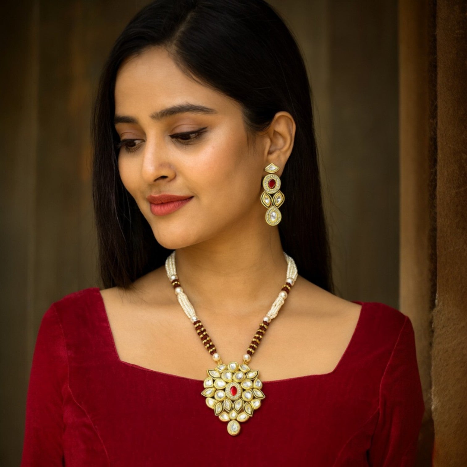 JewelOn Fashion Jewellery Store Kundan long necklace set with matching earrings, featuring maroon and clear stones on a pearl beaded strand.