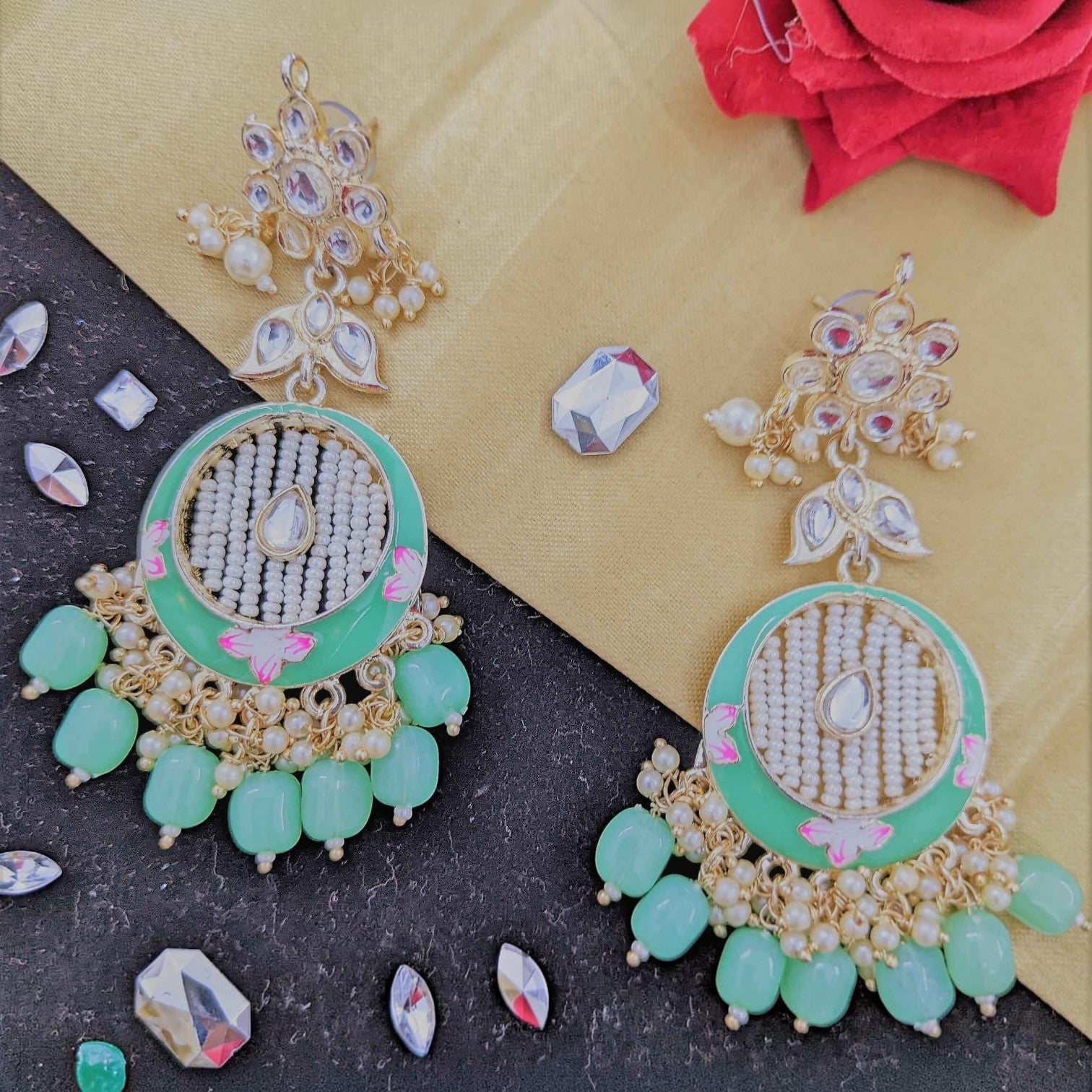 JewelOn Kundan Meenakari earrings with peach and mint green beads, white pearls, and intricate gold detailing.