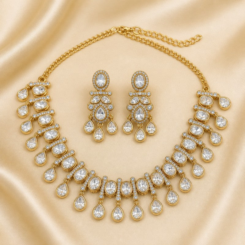 JewelOn gold-tone necklace and chandelier earrings set with clear oval and teardrop-shaped Kundan stones and small white accent stones.
