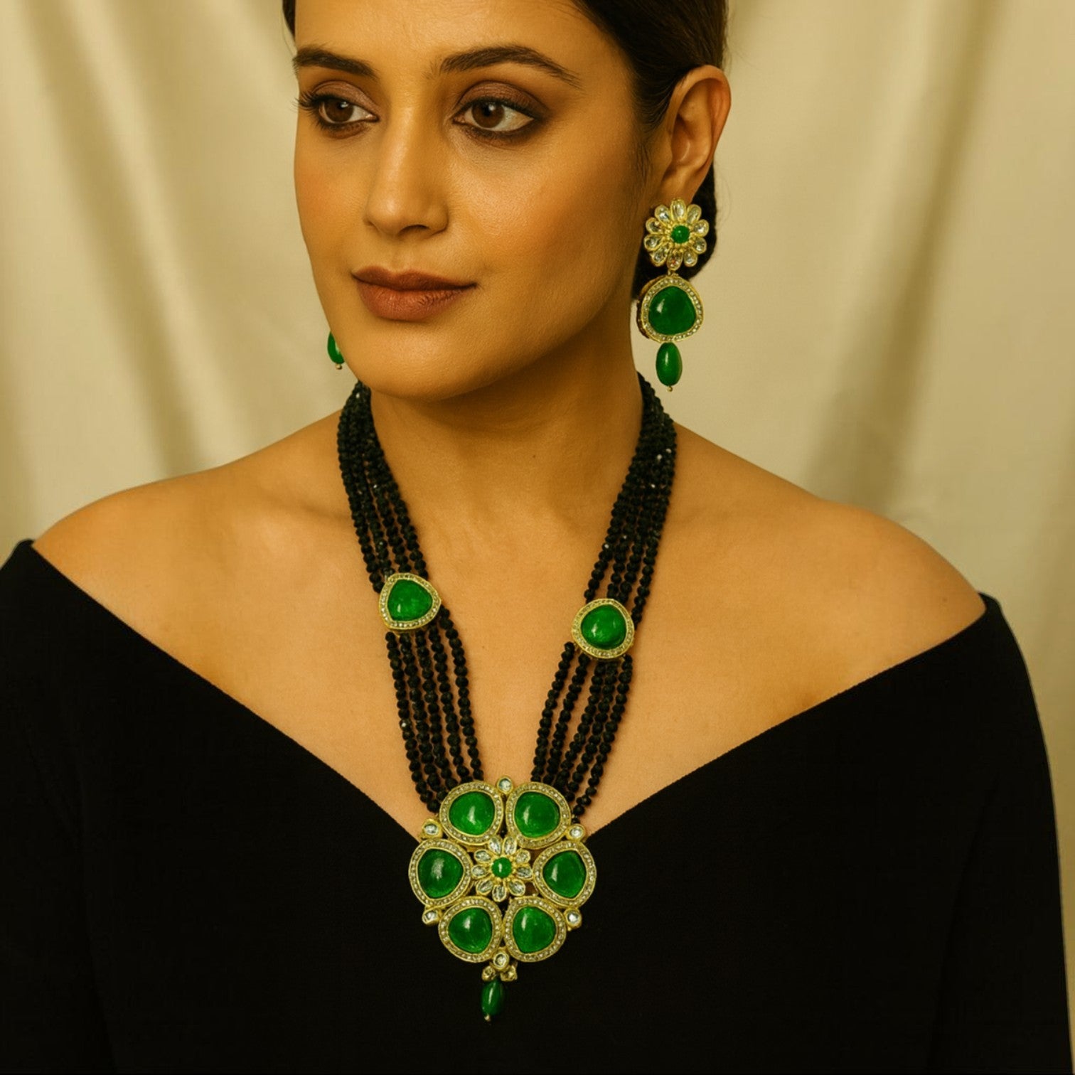 JewelOn Kundan long necklace set with green stones and black beads, includes matching earrings.