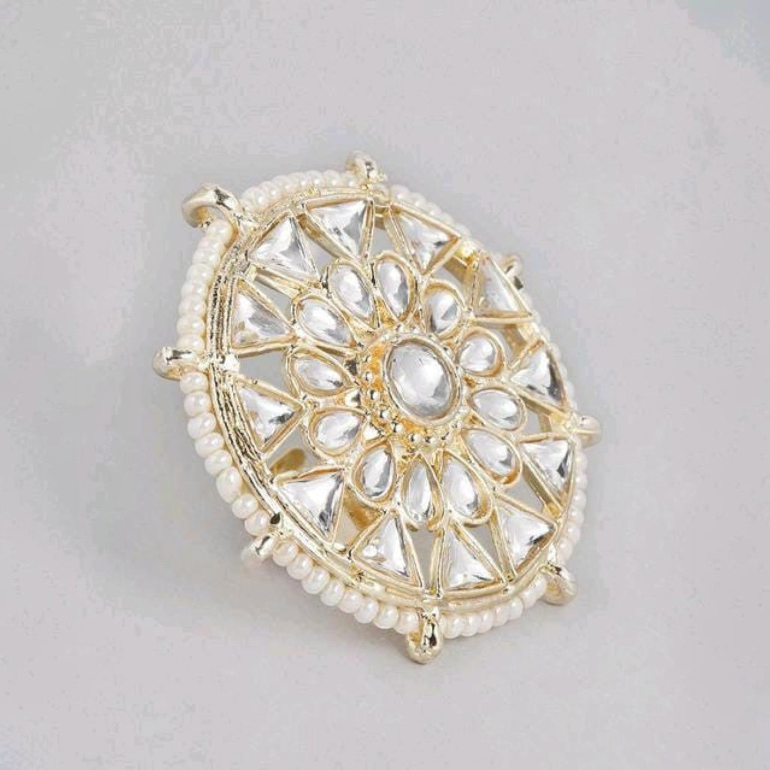 JewelOn gold-tone Kundan ring with clear teardrop and triangular stones and pearl border.