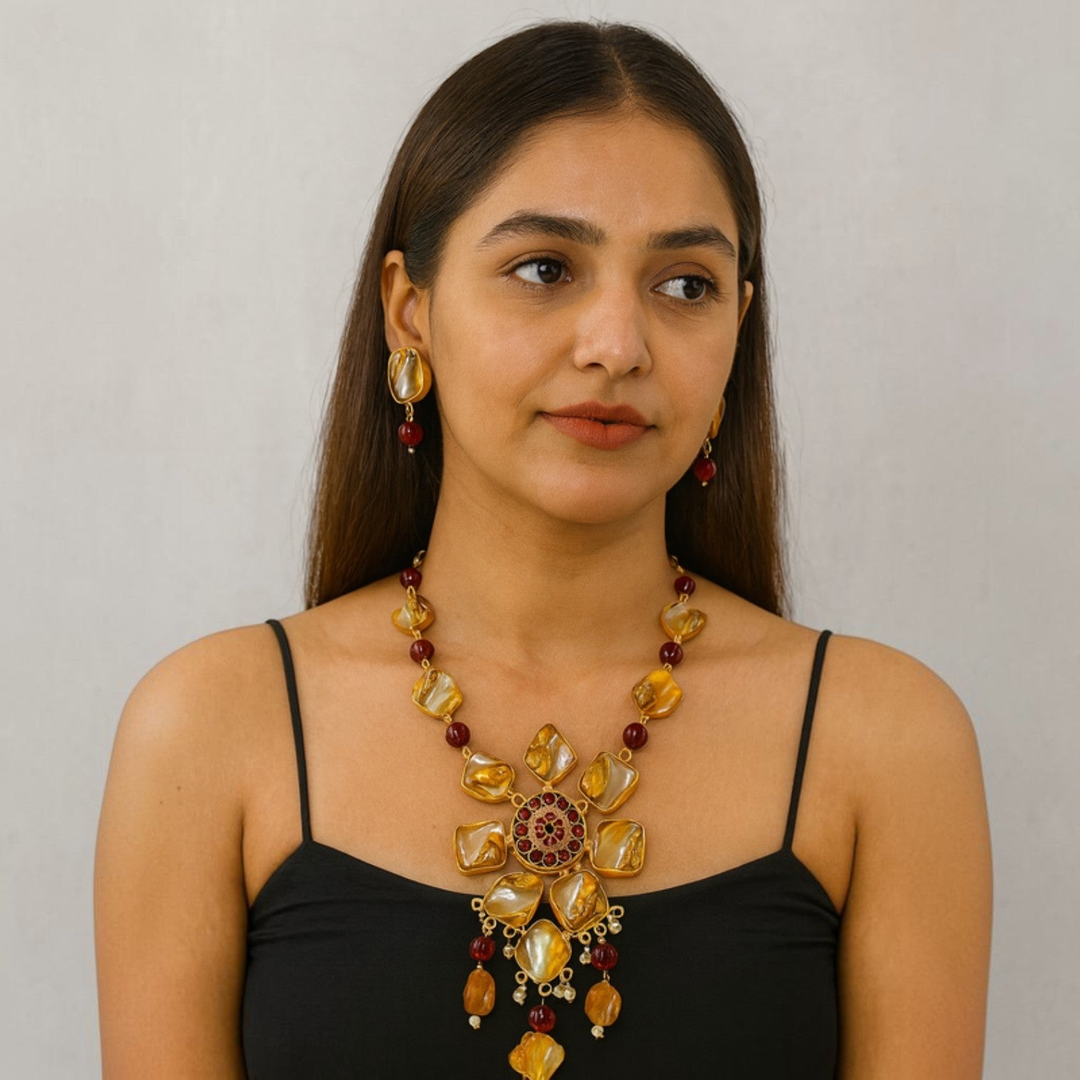 JewelOn Majestic Gleam Stone Necklace Jewellery Set with matching earrings, featuring amber and red stones in a floral design.