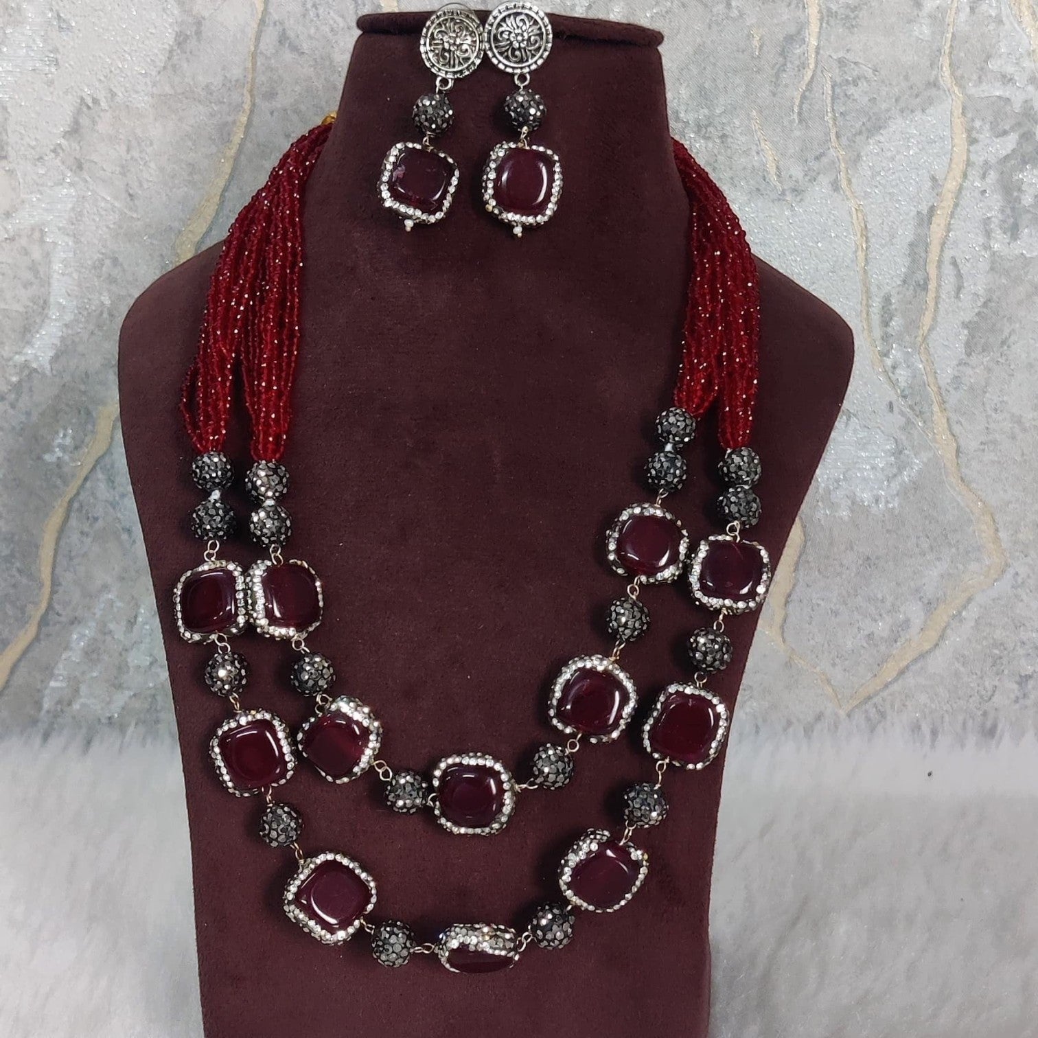 JewelOn maroon semiprecious stone necklace and matching earrings set with gold-plated accents.