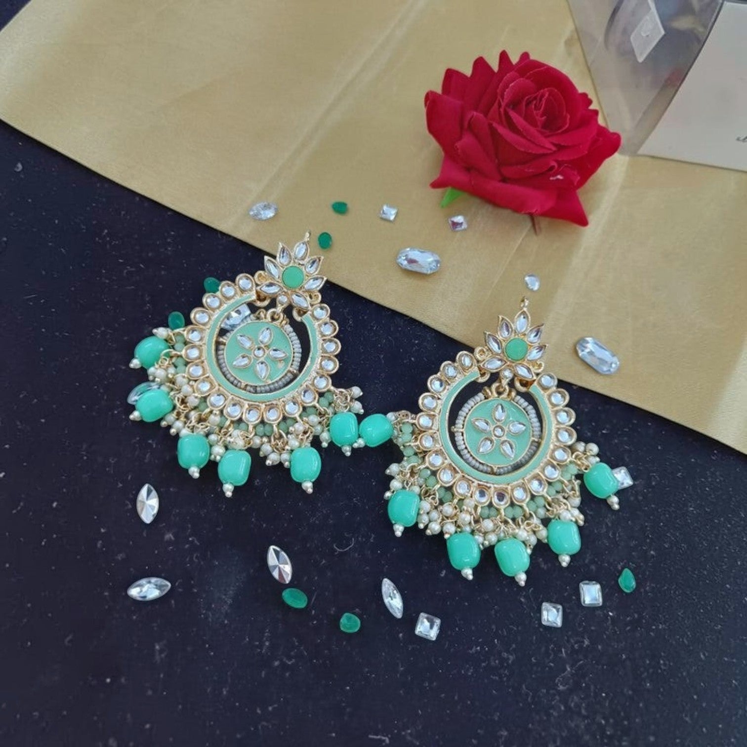 JewelOn Meenakari earrings in mint green with gold accents and pearl beads, featuring intricate floral designs.