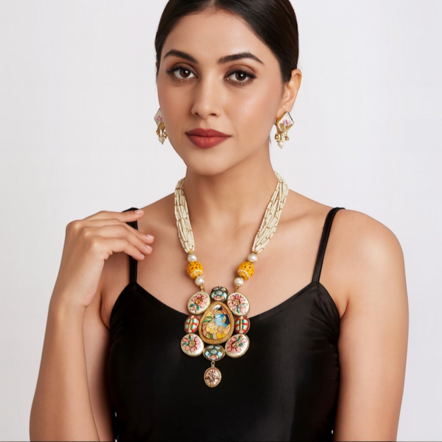 JewelOn Fashion Jewellery Store Meenakari long necklace set with matching earrings, featuring intricate hand-painted details and pearl accents.