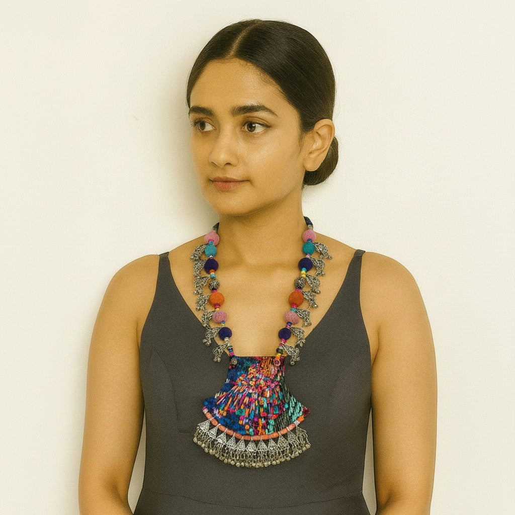 JewelOn Navratri oxidised fabric fusion necklace with colourful pom-poms and silver elephant charms.