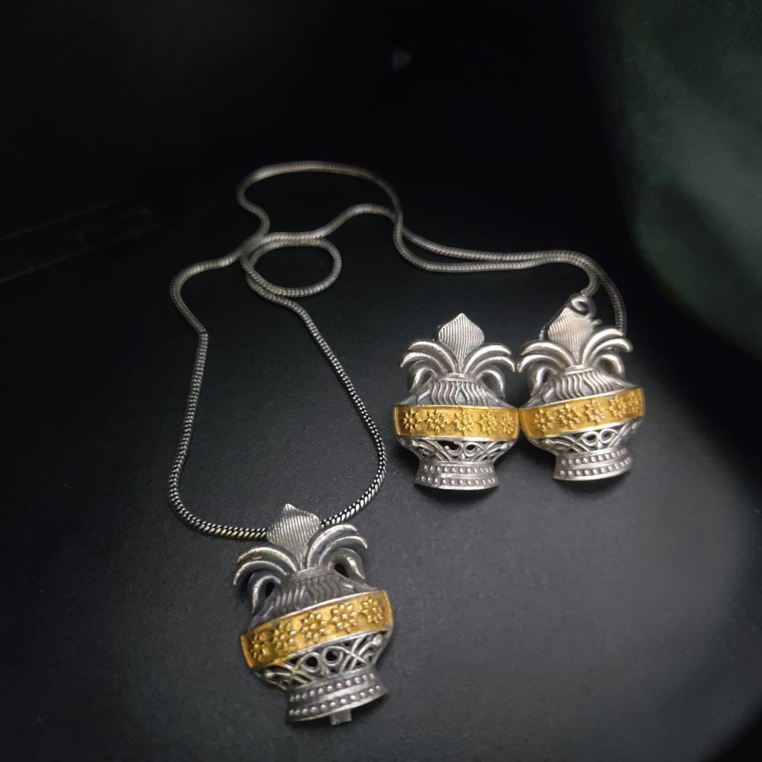 JewelOn Ahana Divine Hue 2 Tone Oxidise Pendant Jewellery Set with silver polish finish and gold accents.