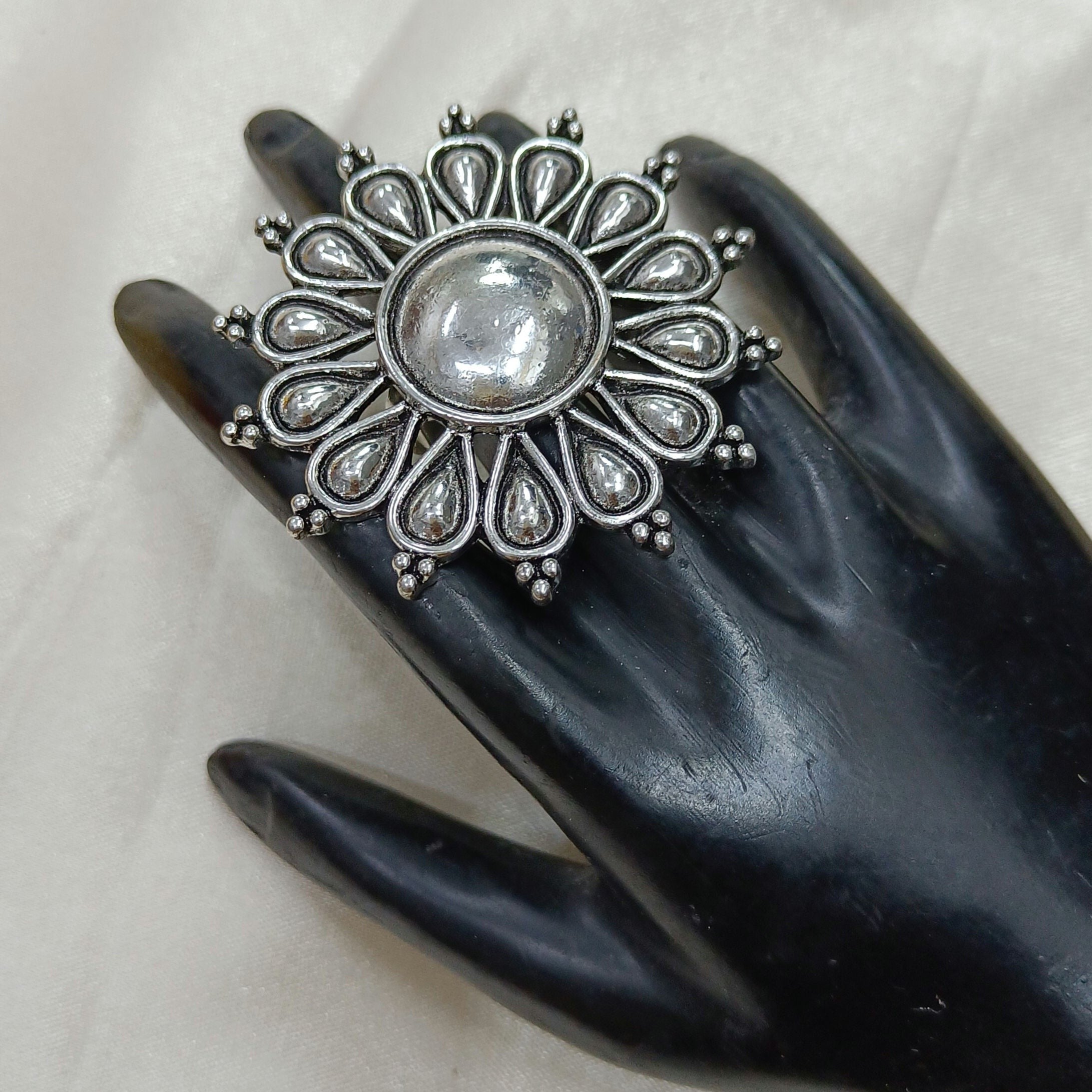 JewelOn Clara Divine Oxidised Big Ring with silver polish finish and American Diamond stones.