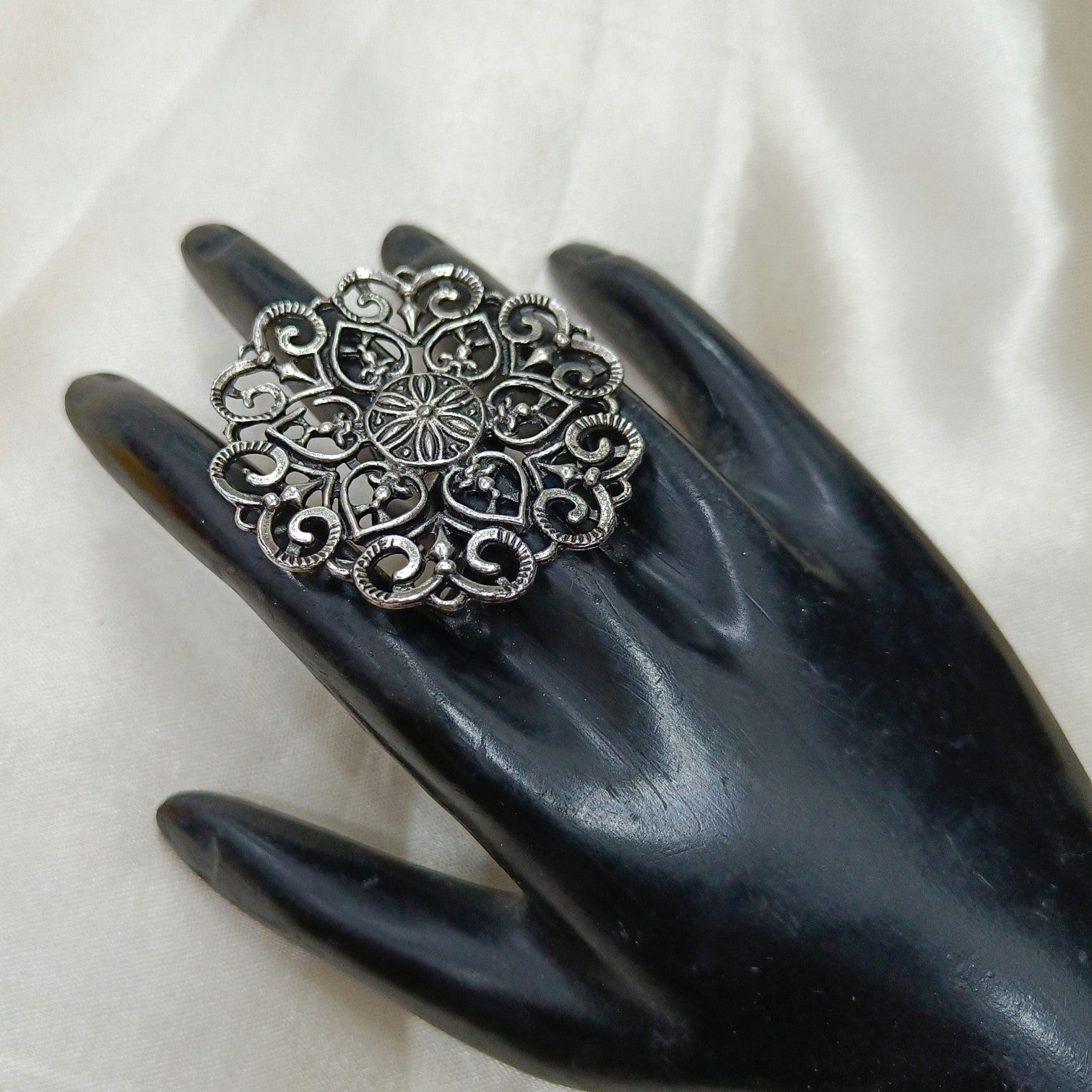 JewelOn Daksha Oxidised Big Ring with intricate floral design and silver polish finish, adorned with American Diamonds.