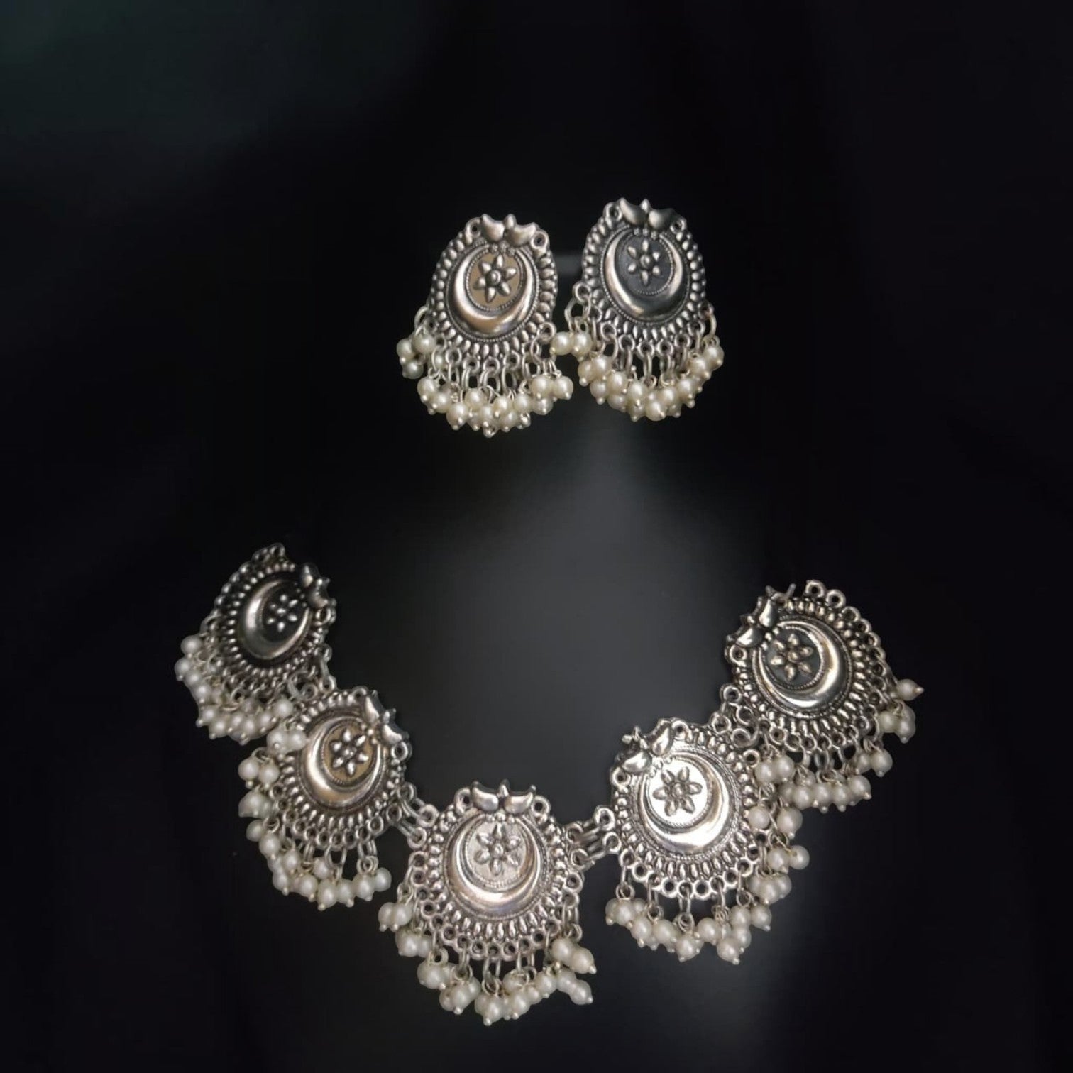 JewelOn Nia Oxidised choker necklace and earrings set with pearl drops and moon motifs in silver polish.