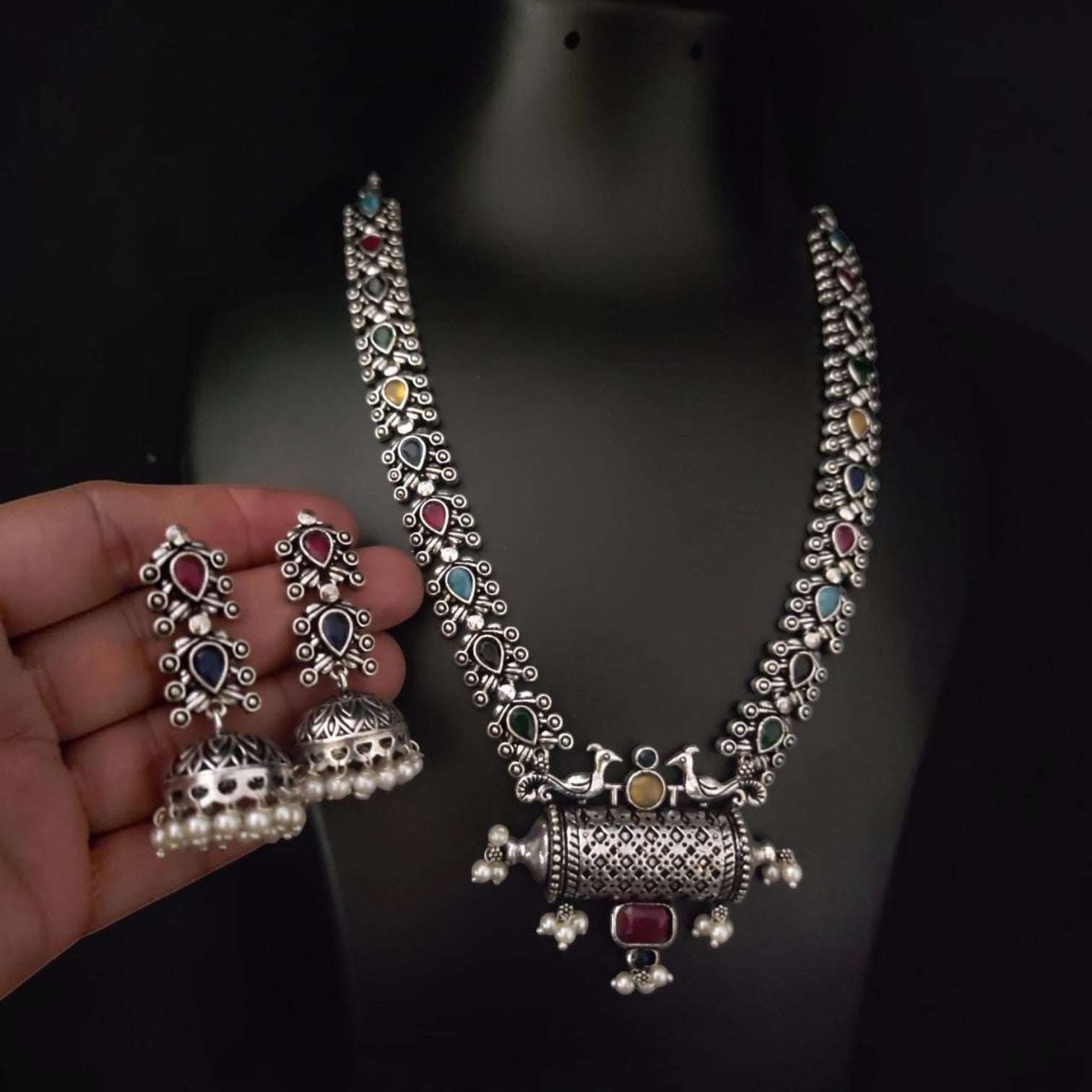 JewelOn oxidised silver necklace and jhumka earrings set with colourful teardrop stones and pearl accents.