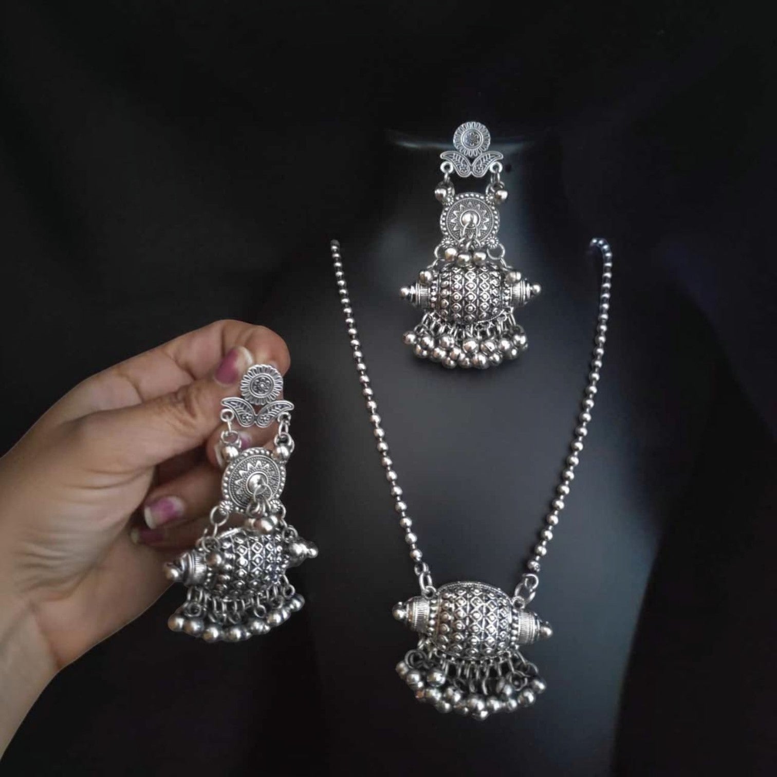 JewelOn silver oxidised pendant necklace and matching earrings set with intricate tribal design and dangling ghungroos.