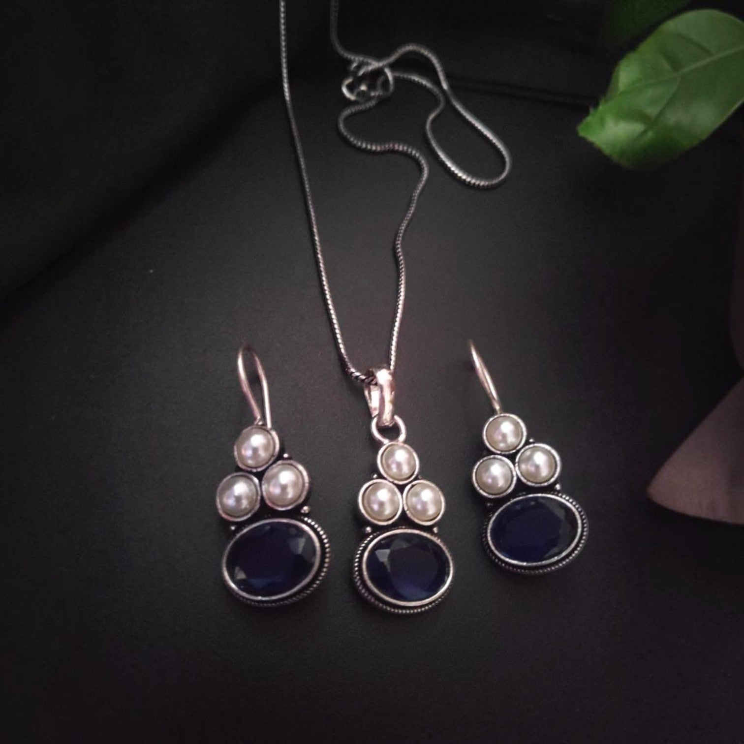 JewelOn Oviya Fine Elegance oxidised silver pendant necklace and earrings set with blue stones and pearls.