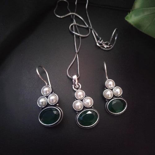 JewelOn oxidised pendant necklace and earrings set with green oval stones and pearls.