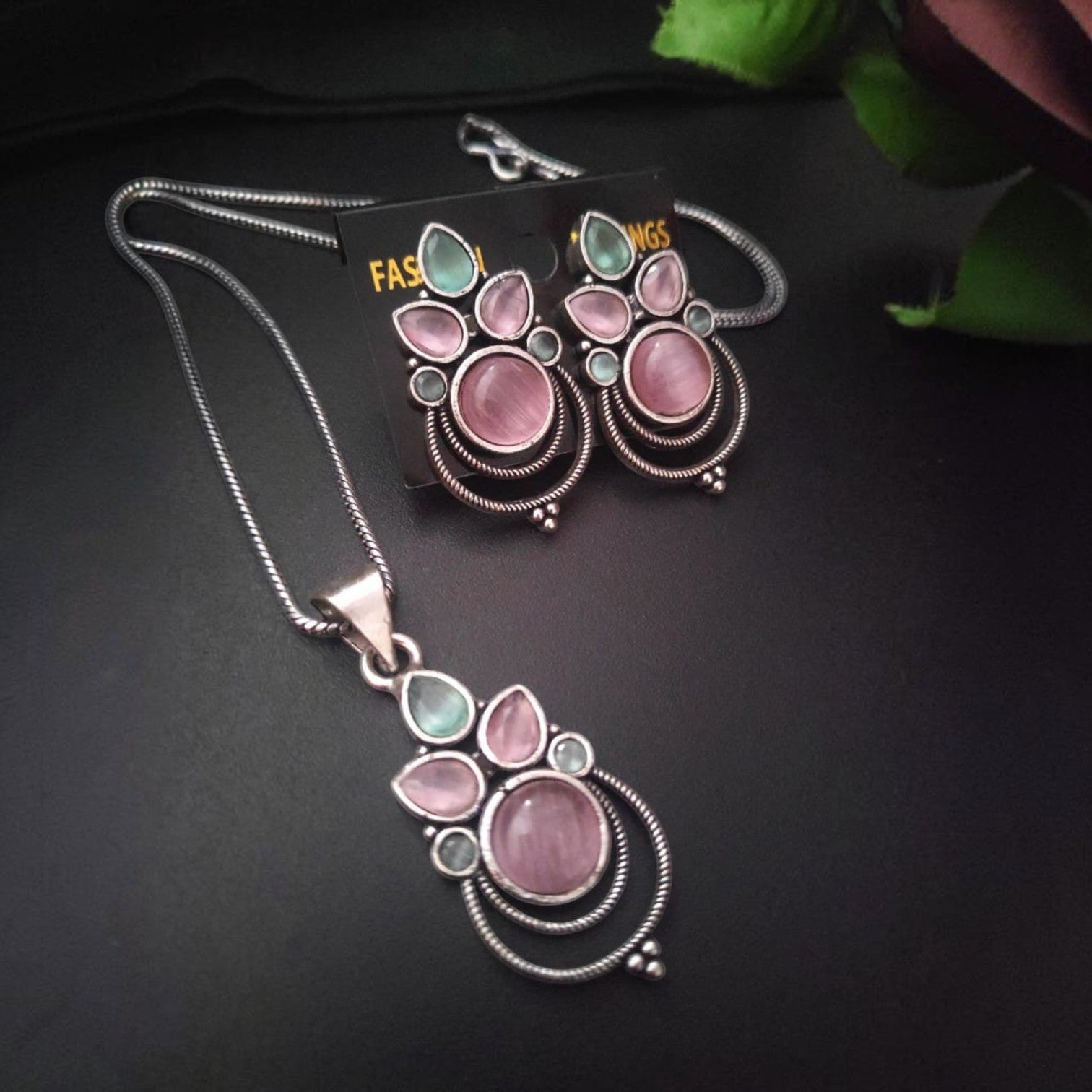 JewelOn oxidised pendant necklace and matching earrings set with pink and green stones. Elegant fusion jewellery.