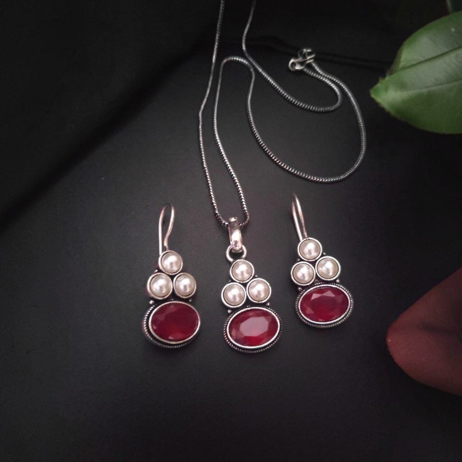 JewelOn silver-tone pendant necklace and matching earrings set with oval red stones and pearl accents.