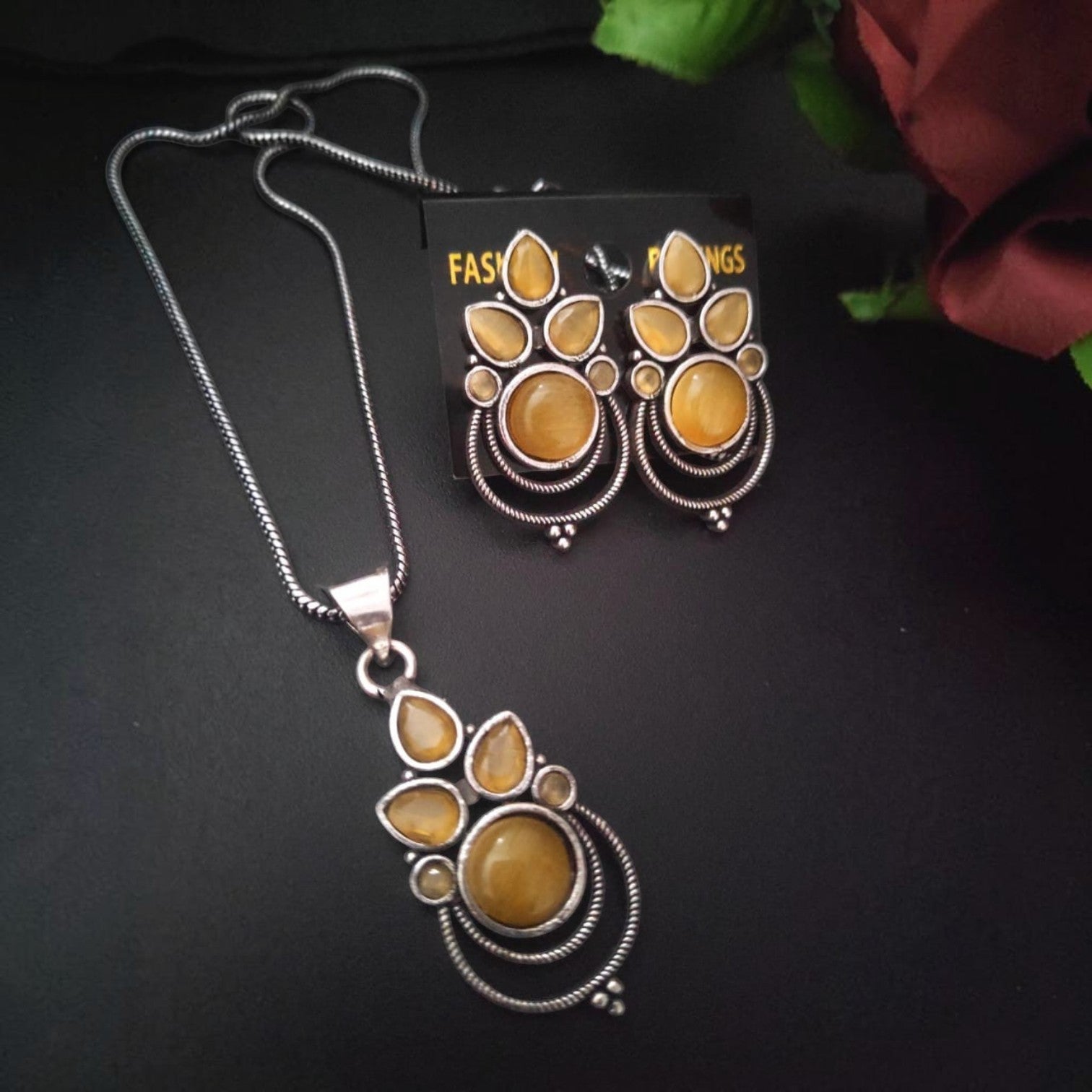 JewelOn oxidised silver pendant necklace and matching earrings set with yellow stones. Elegant fusion jewellery.