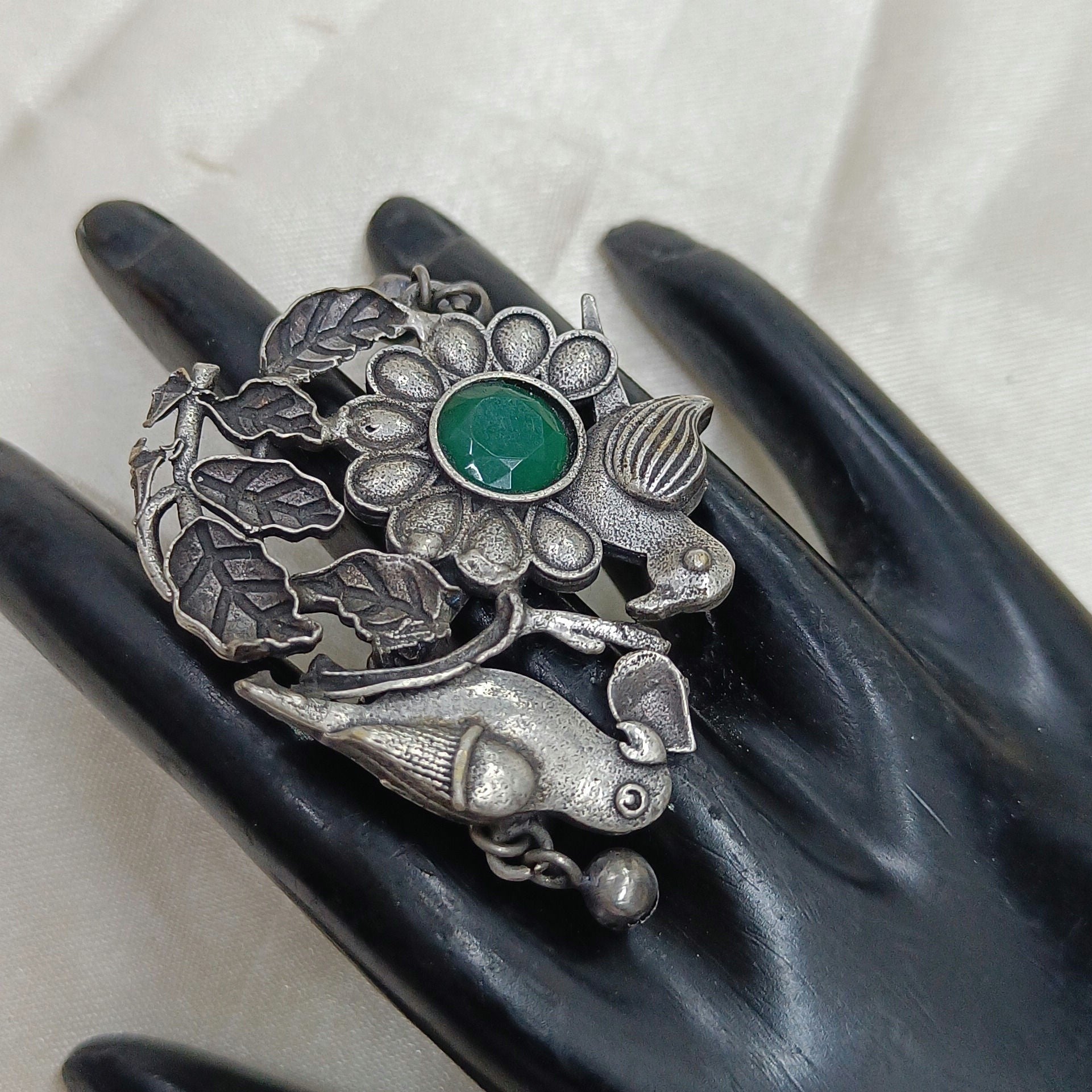 JewelOn oxidized silver plated ring with green stone, floral design, and two birds. Features intricate detailing and a vintage aesthetic.