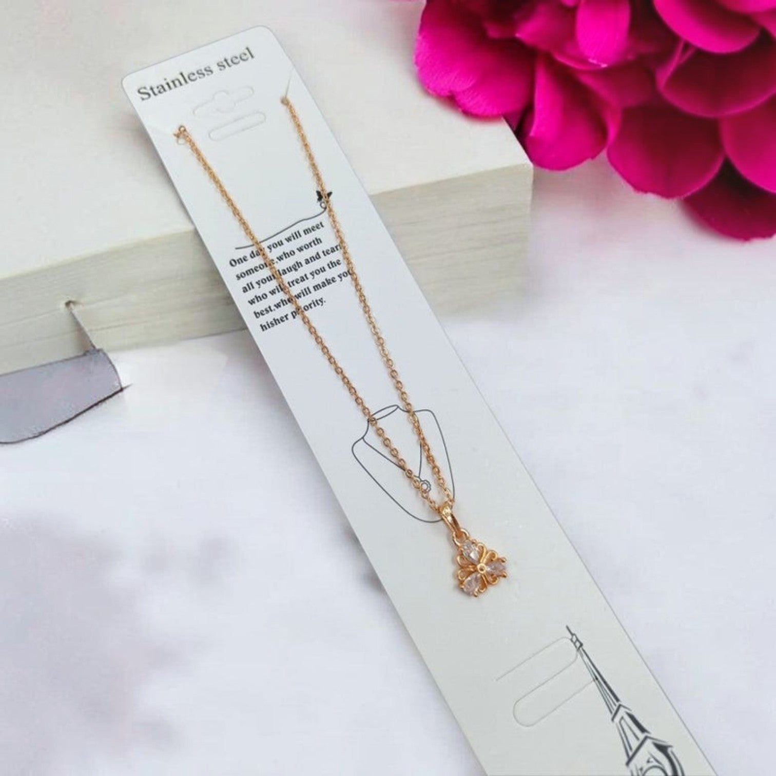 JewelOn Fashion Jewellery Store Online gold-tone pendant chain necklace with a floral-shaped pendant adorned with clear stones.