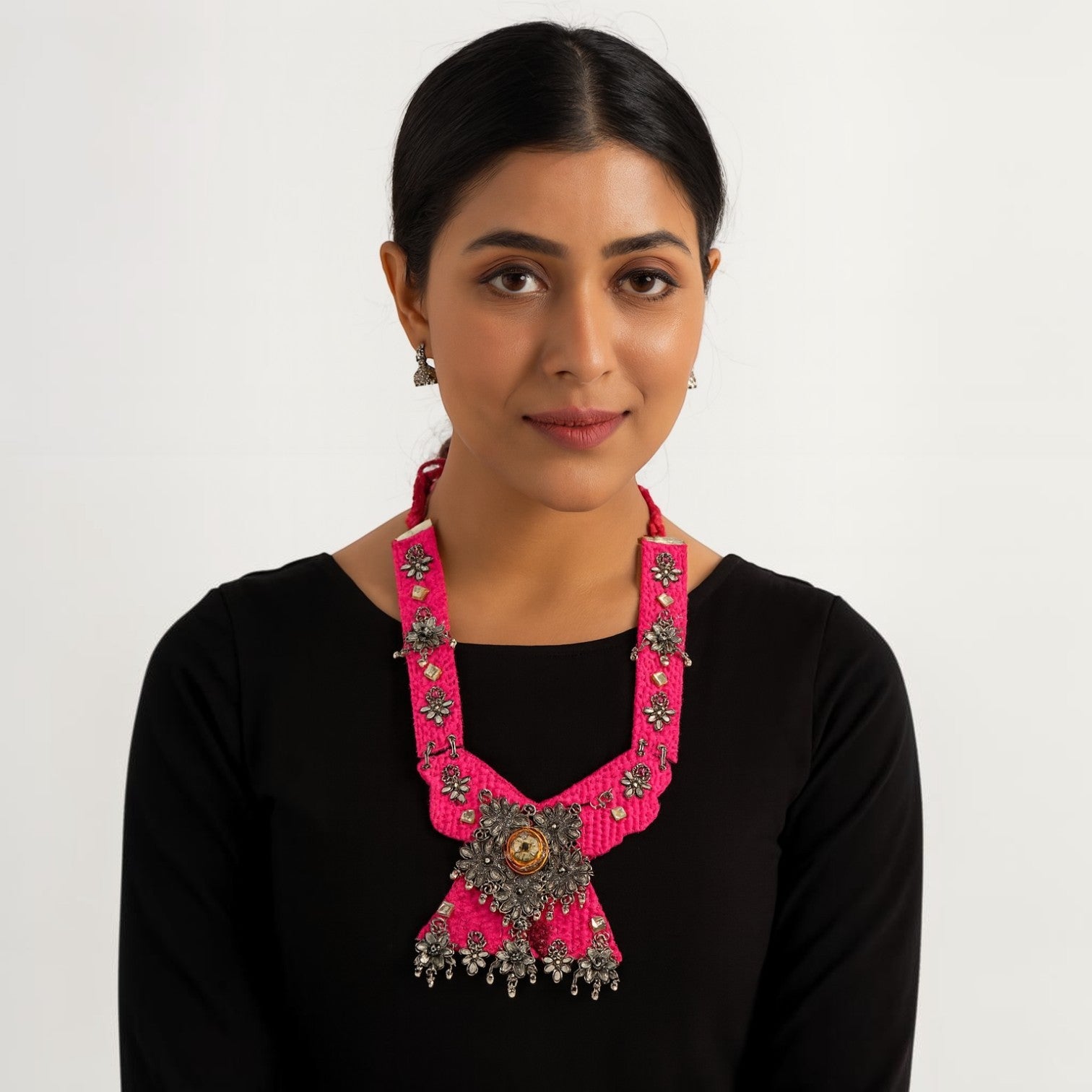 JewelOn pink handmade oxidised fabric fusion jewellery necklace with floral embellishments and dangling charms.