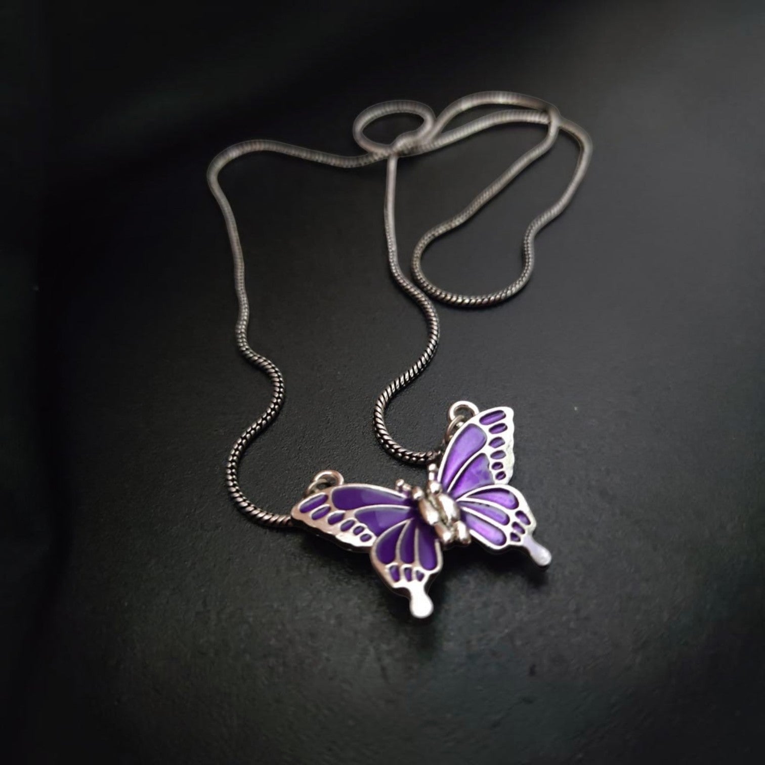 Jewelon Ethereal Detail Magnetic Pendant Necklace with purple butterfly design and silver chain.