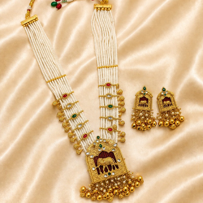 JewelOn Rajwadi necklace set with maroon, green, and pearl beads, gold-tone elephant pendant, and matching earrings.