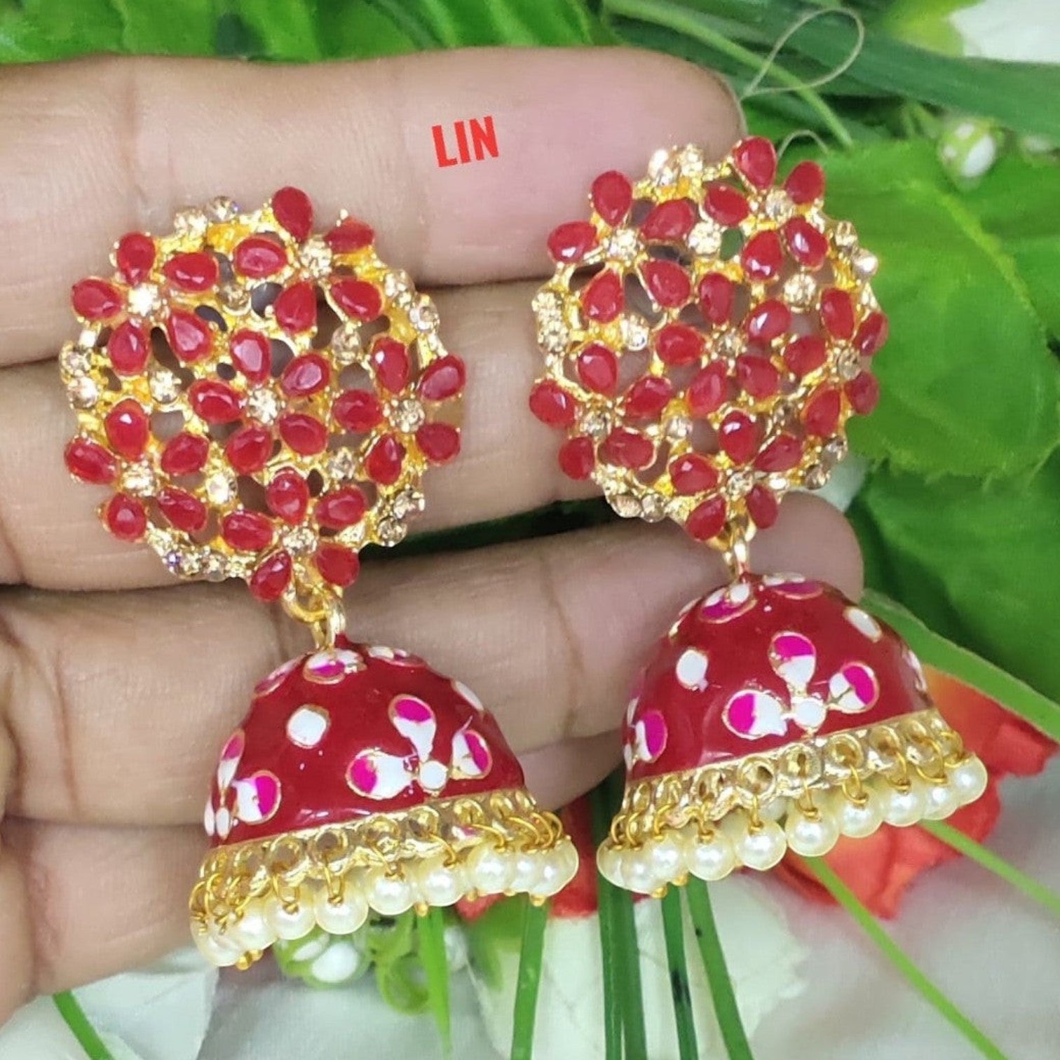 JewelOn red Meenakari jhumka earrings with gold accents and pearl drops. Intricate floral design.