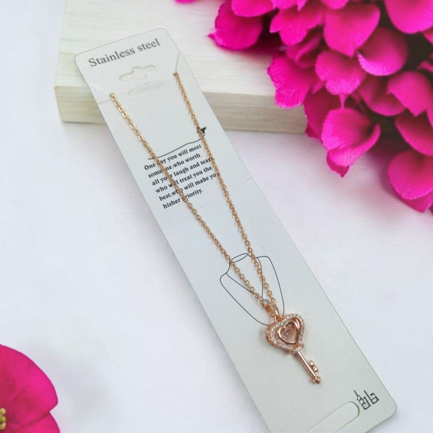JewelOn Fashion Jewellery Store Online rose gold key pendant necklace with heart detail and cubic zirconia stones.