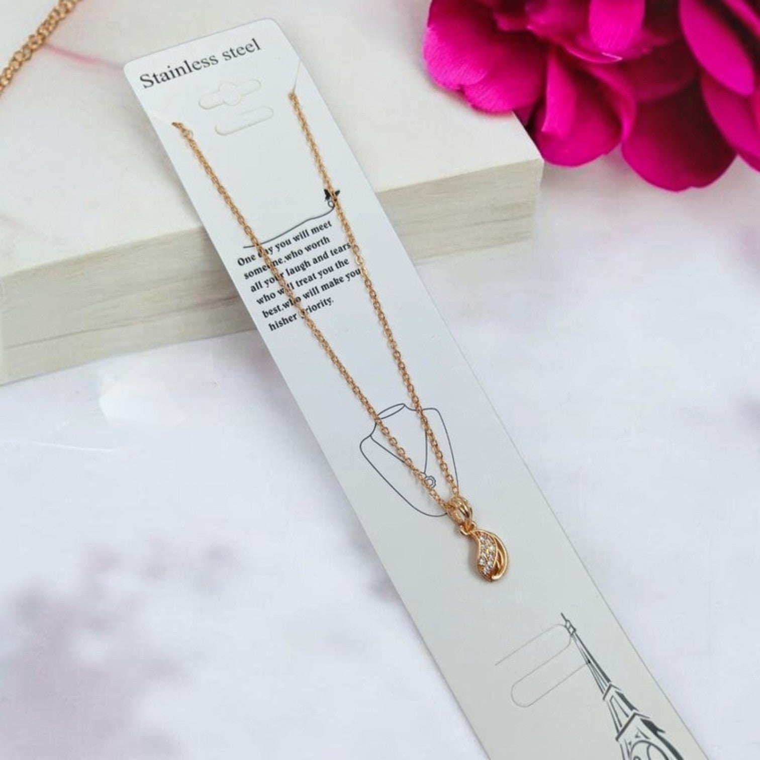 JewelOn rose gold chain necklace with a teardrop pendant adorned with clear stones.