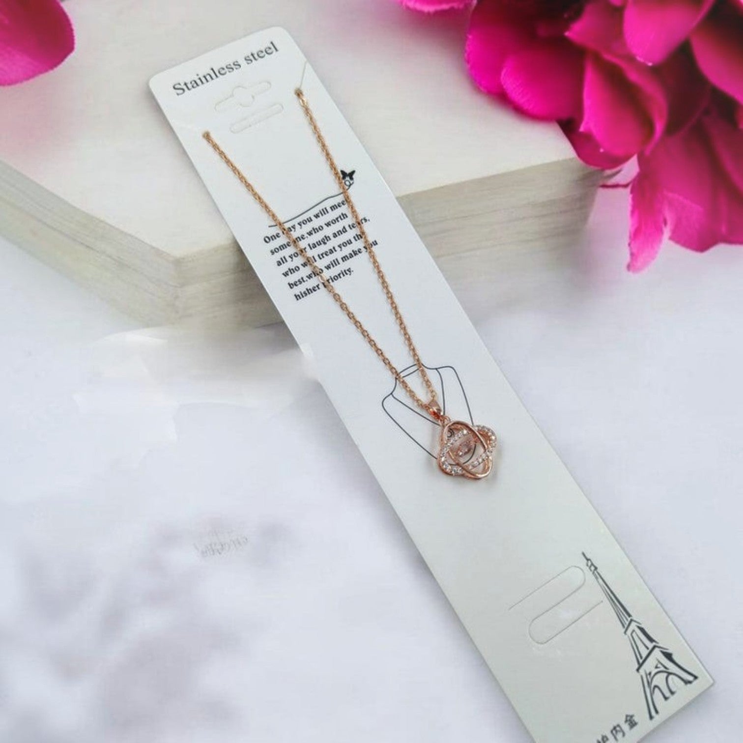 JewelOn rose gold pendant necklace with cubic zirconia stones on a delicate chain. Subtle Rhythm design.