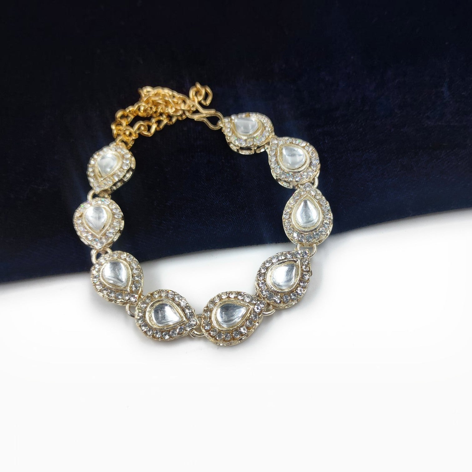 JewelOn silver polish adjustable bracelet with teardrop-shaped American diamonds and small accent stones.
