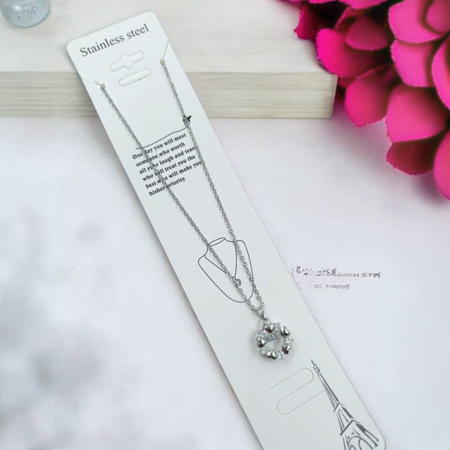 JewelOn silver pendant chain necklace with a circular design of small heart-shaped stones.