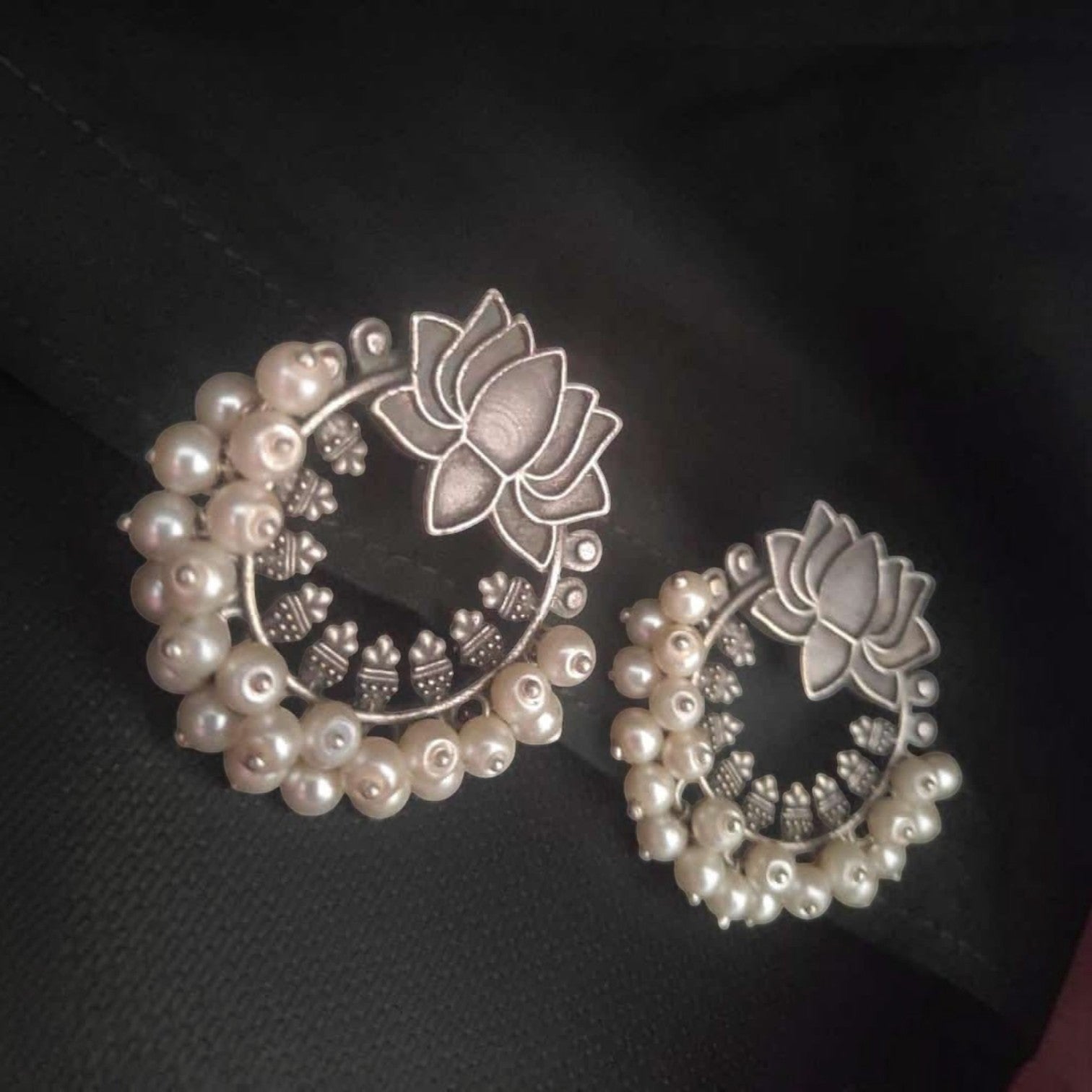 JewelOn silver lotus stud earrings with pearl accents. Round design with intricate detailing.