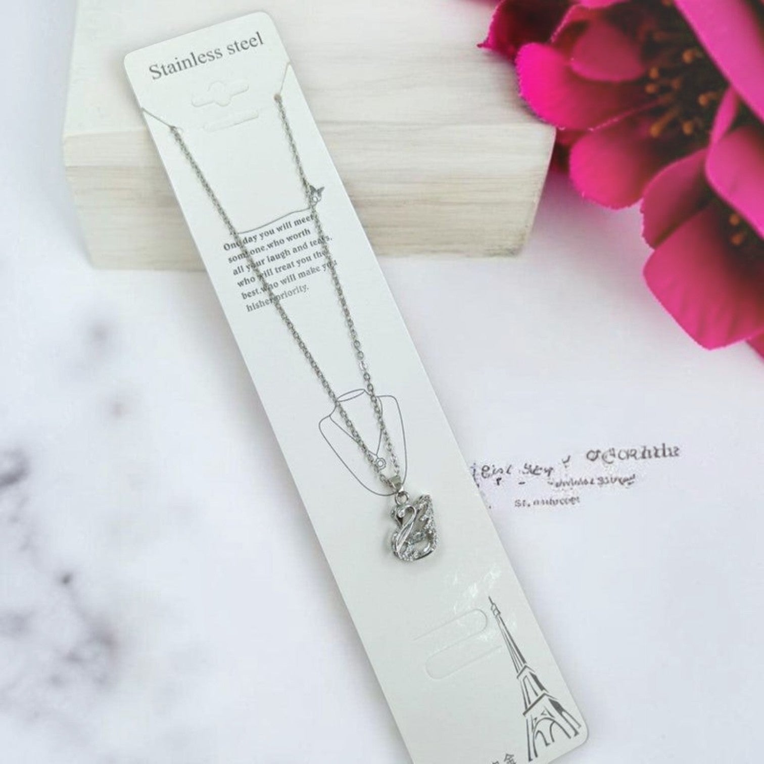 JewelOn silver-tone pendant necklace with swan design and American diamonds. Stainless steel chain.