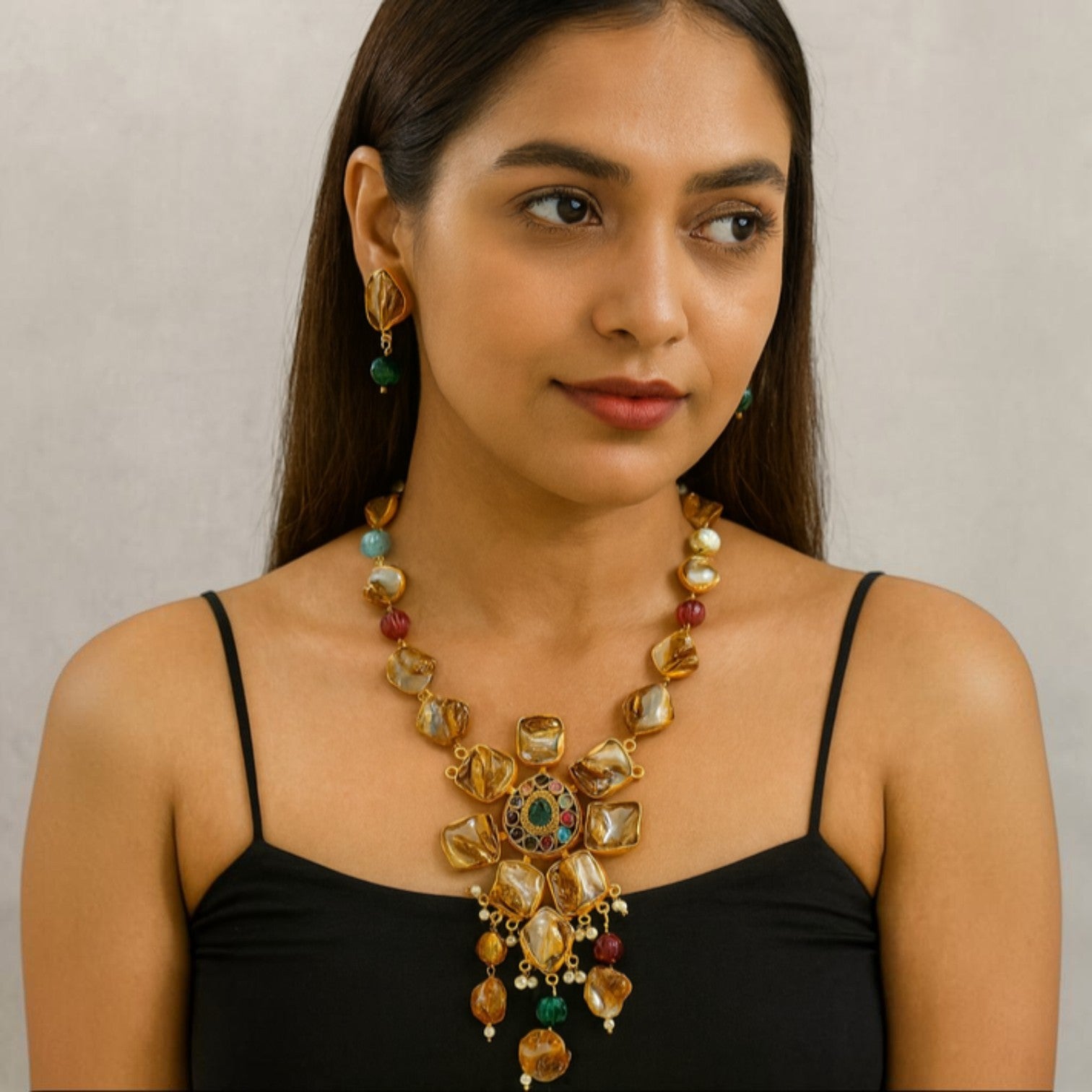 JewelOn vintage-inspired necklace and earrings set with semi-precious stones in gold, amber, green, and red hues.